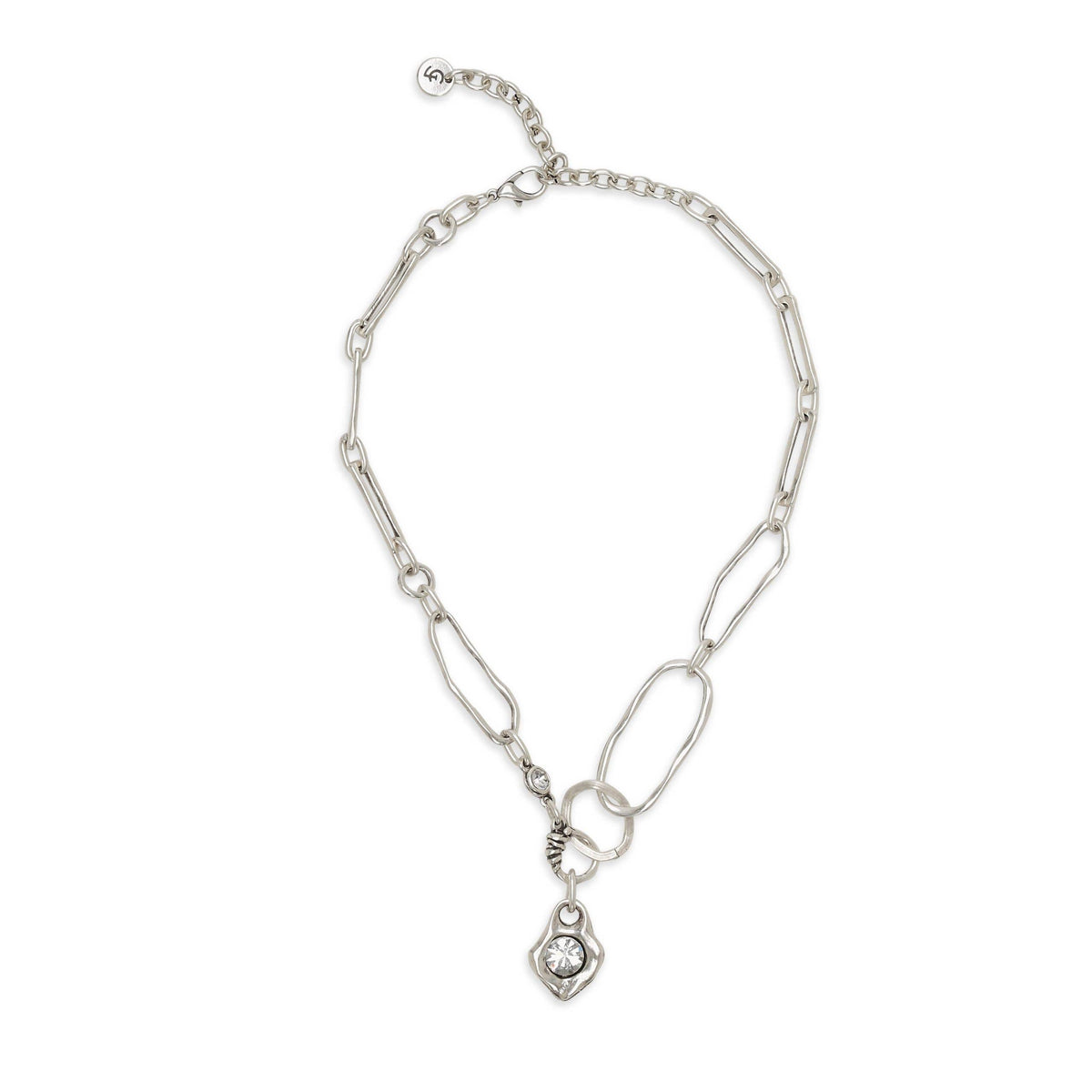 A silver-toned paperclip chain necklace with a small pendant featuring a clear round gemstone, displayed on a clean white background.
