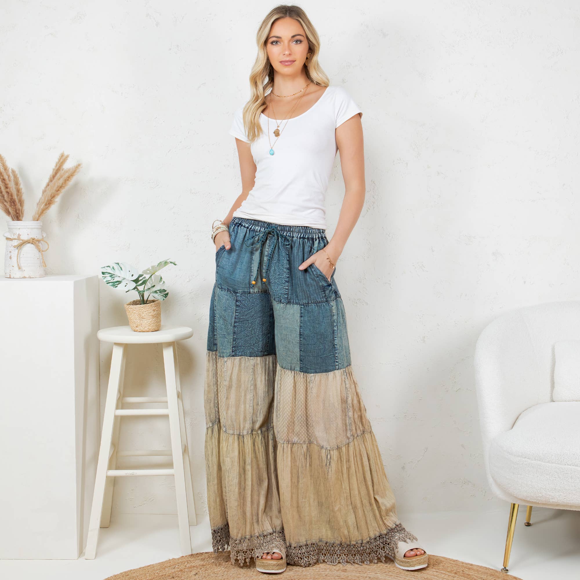 Wanderlust patchwork wide-leg pants - front view showing artisanal denim, lace and embroidered fabric mix with elastic waist