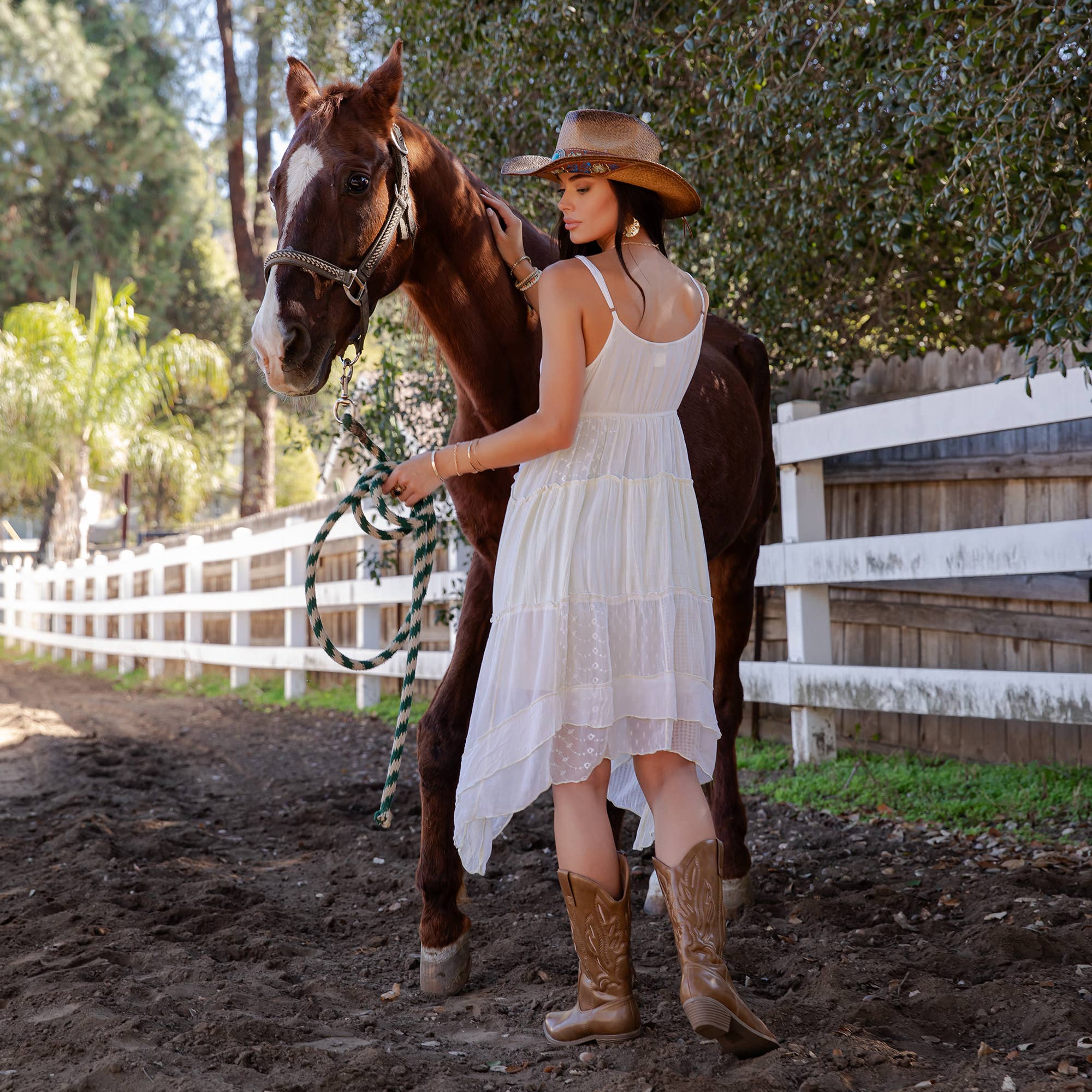 Daydream Believer dress back view - ruched bodice with flowing asymmetric tiered skirt in pearl