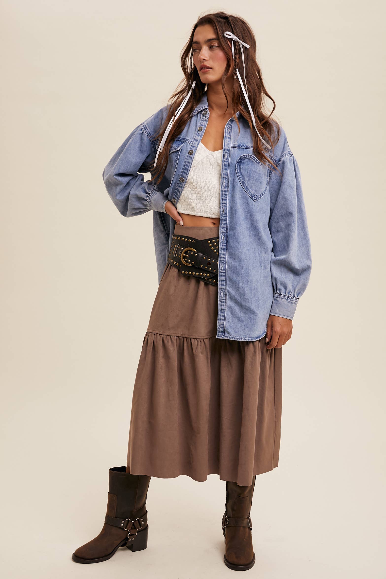 Light-wash oversized denim shacket with a heart-shaped chest pocket, button front, drop shoulders, balloon sleeves, and a curved hem.