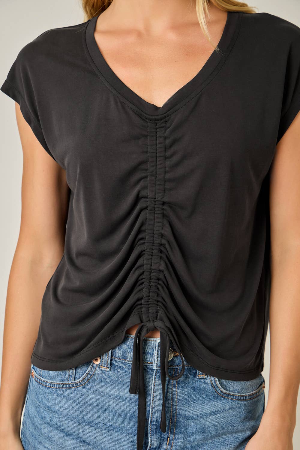 Close up Ruched Front Drawstring Modal Top in Black — flattering ruched silhouette with cap sleeves and V-neckline