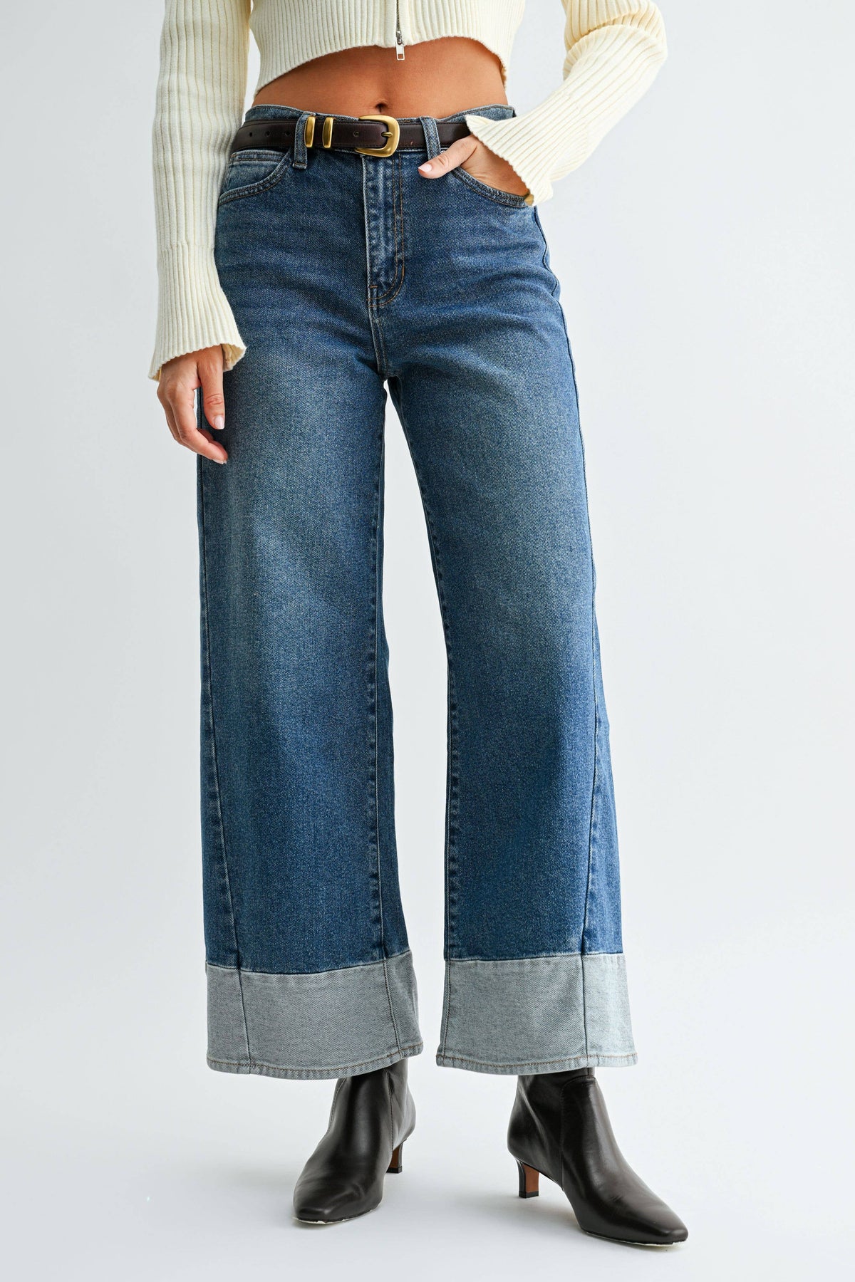Front view of Blue Hour Two-Tone Wide Leg Jeans with faded blue denim, vertical leg seams, and contrasting light denim hems.