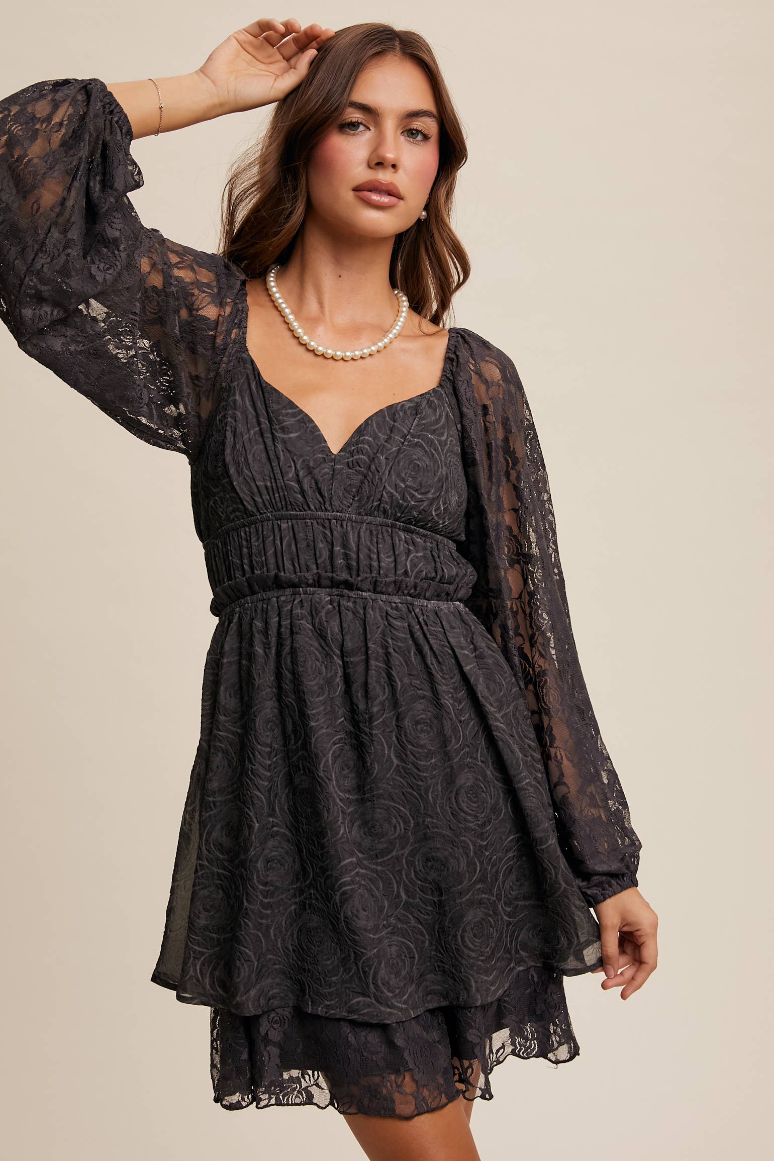 Close-up of floral lace detailing and layered hem on The Midnight Lace Dress