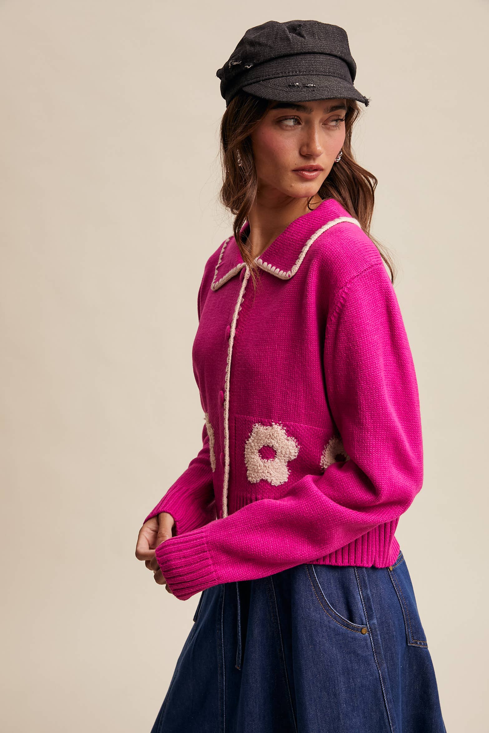 Women’s floral collar knit cardigan with button-front design, soft textured fabric, and contrast flower-patterned collar — stylish layering sweater for everyday wear.