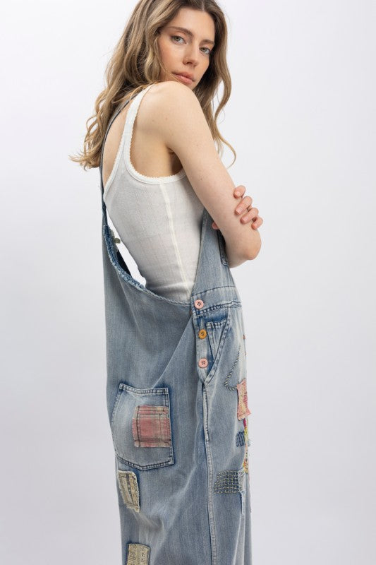 Designed with roomy front and side pockets for functionality, adjustable shoulder straps for a custom fit, and an easy, flowy leg for all-day comfort.