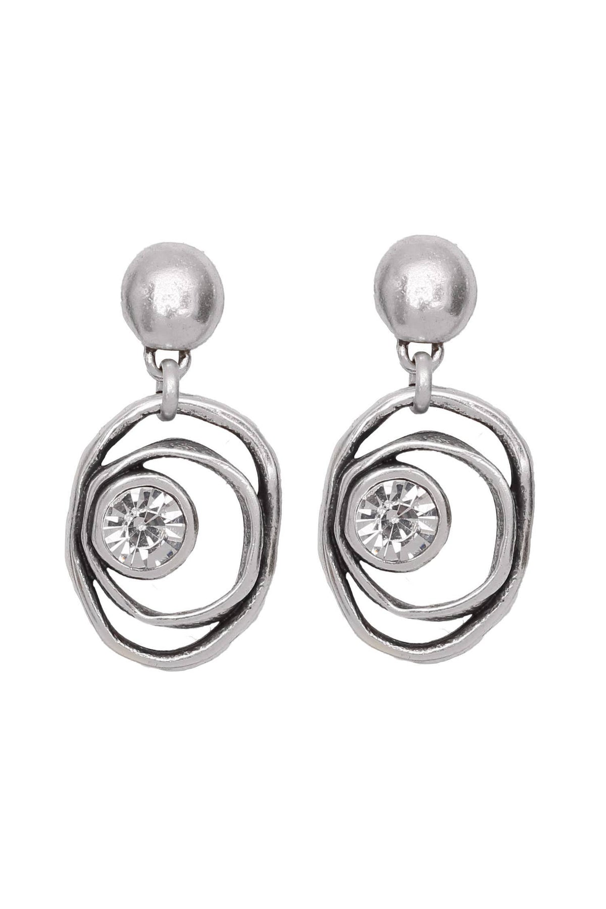 Silver earrings with circular designs and clear gemstones on a white background