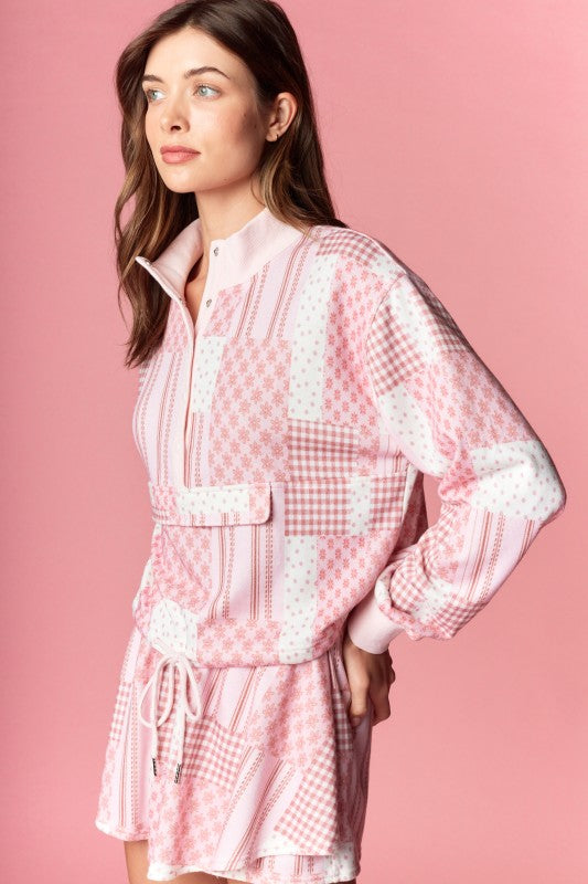 The soft fabric and relaxed fit make it as comfortable as it is stylish, while the patchwork gingham and floral patterns add a nostalgic, handcrafted feel.