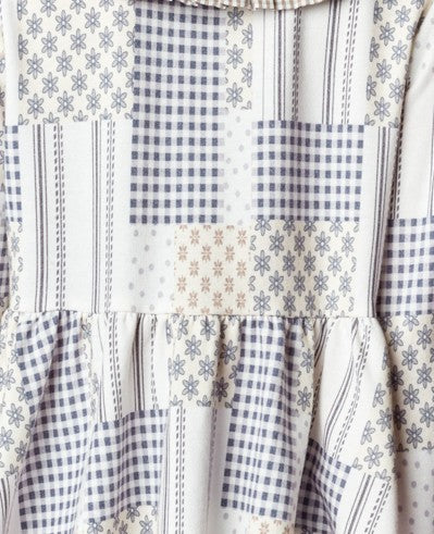 The soft fabric and relaxed fit make it as comfortable as it is stylish, while the patchwork gingham and floral patterns add a nostalgic, handcrafted feel.