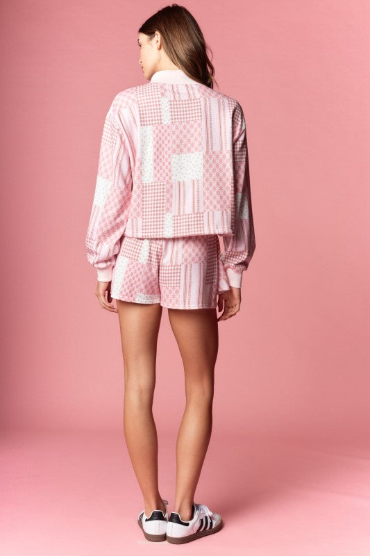 The soft fabric and relaxed fit make it as comfortable as it is stylish, while the patchwork gingham and floral patterns add a nostalgic, handcrafted feel.