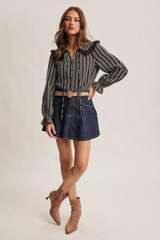 Black vertical-striped long-sleeve blouse with lace ruffle collar and button front.