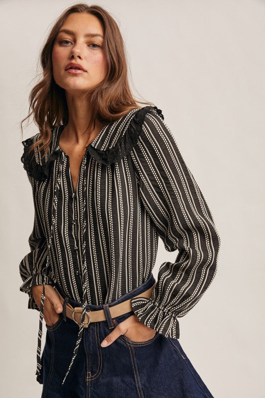 Black vertical-striped long-sleeve blouse with lace ruffle collar and button front.