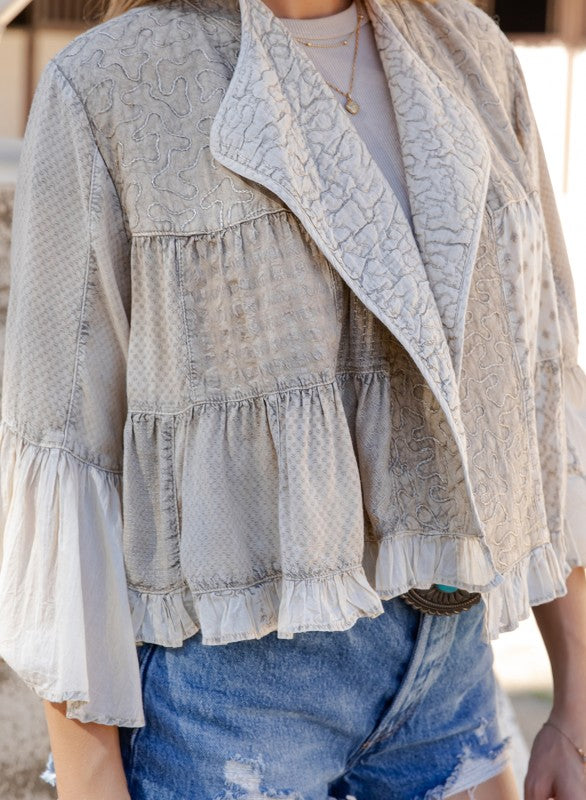 The Whimsy Embroidered Bell Sleeve Crop Top - detail of front-open design and textured rayon fabric