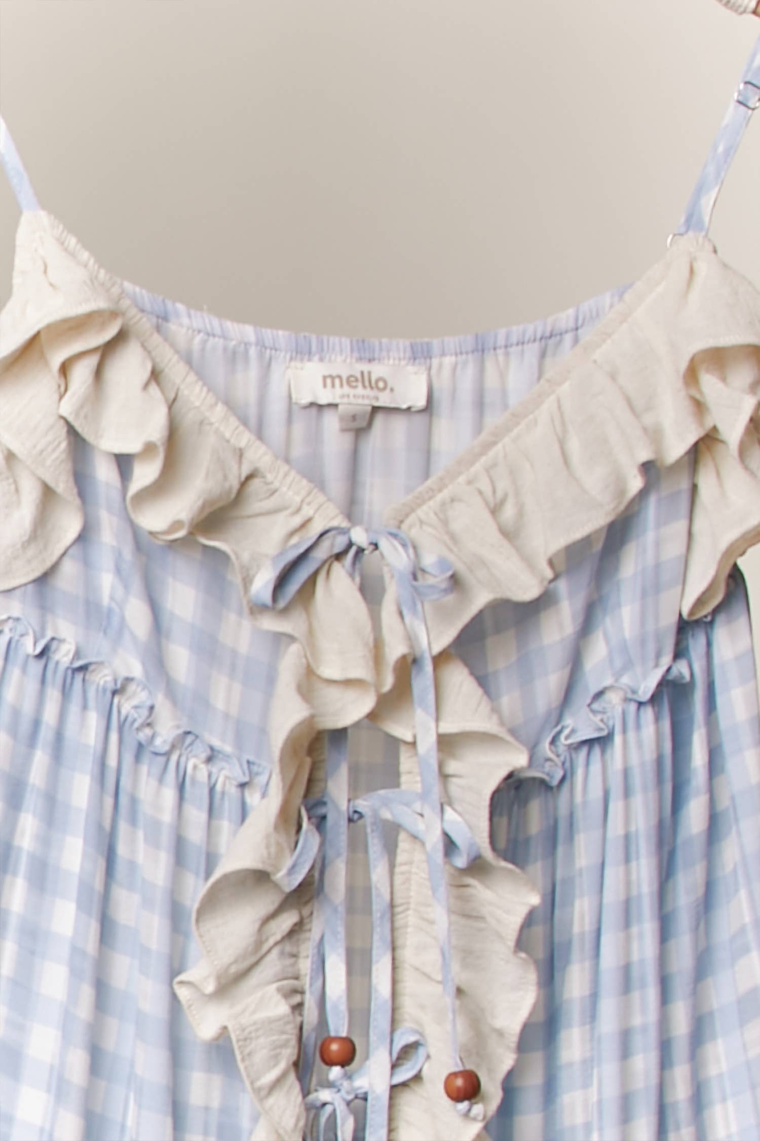 Blue ruffle cardigan dress detail - close-up of luxurious flowing fabric and cascading ruffle construction