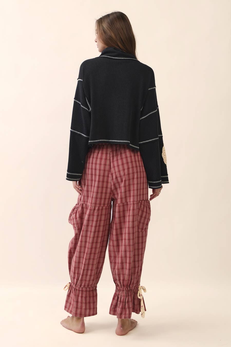 Back view Plus size dark cherry gingham ruffle bloomer pants with floral patch pockets and tie ruffle hem detail — Spirit & Wind Boutique