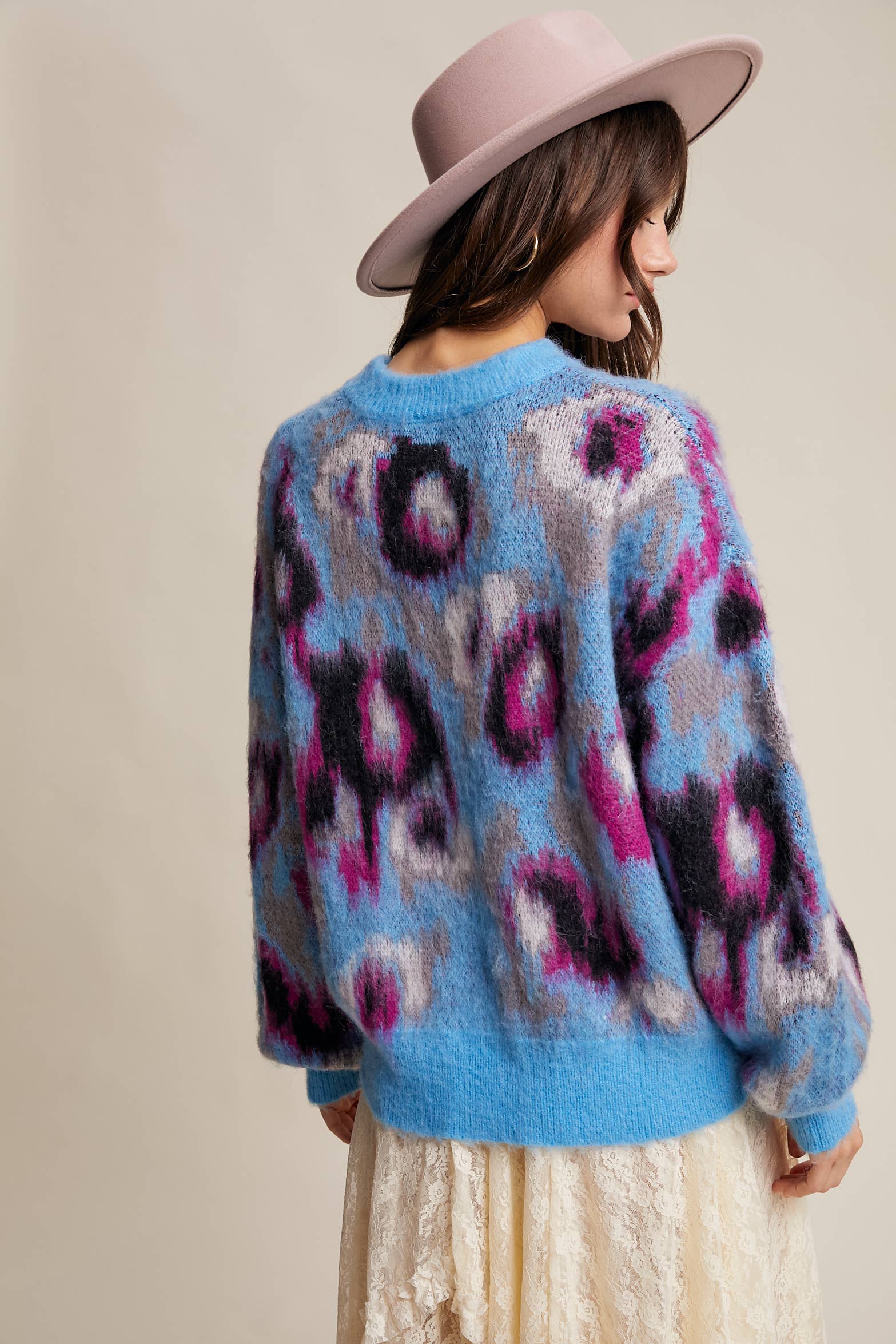 Back View Women’s fuzzy abstract leopard knit pullover sweater with soft textured fabric and bold animal print — cozy statement top for modern chic outfits.
