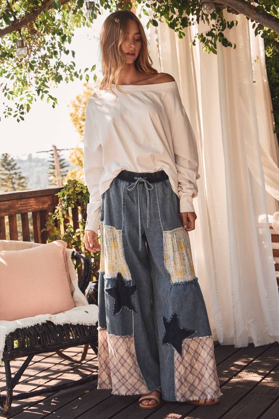 Plus size mixed fabric patchwork wide leg pants in washed denim with lace inserts, star appliqué, and drawstring waist — boho-luxe women's pants by Spirit & Wind Boutique