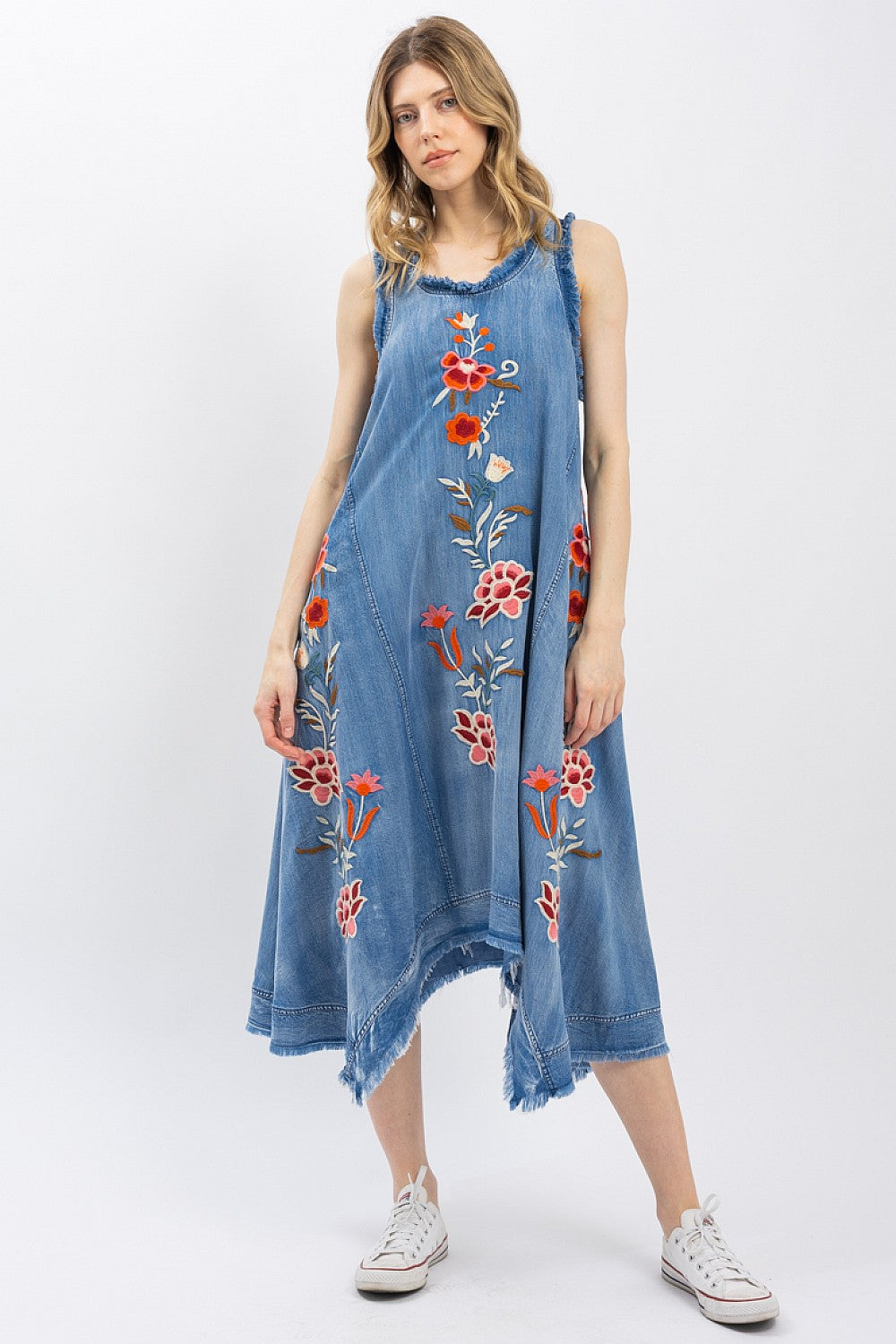 Close-up of The Indigo Wildflower Dress floral embroidery detail on indigo Tencel denim