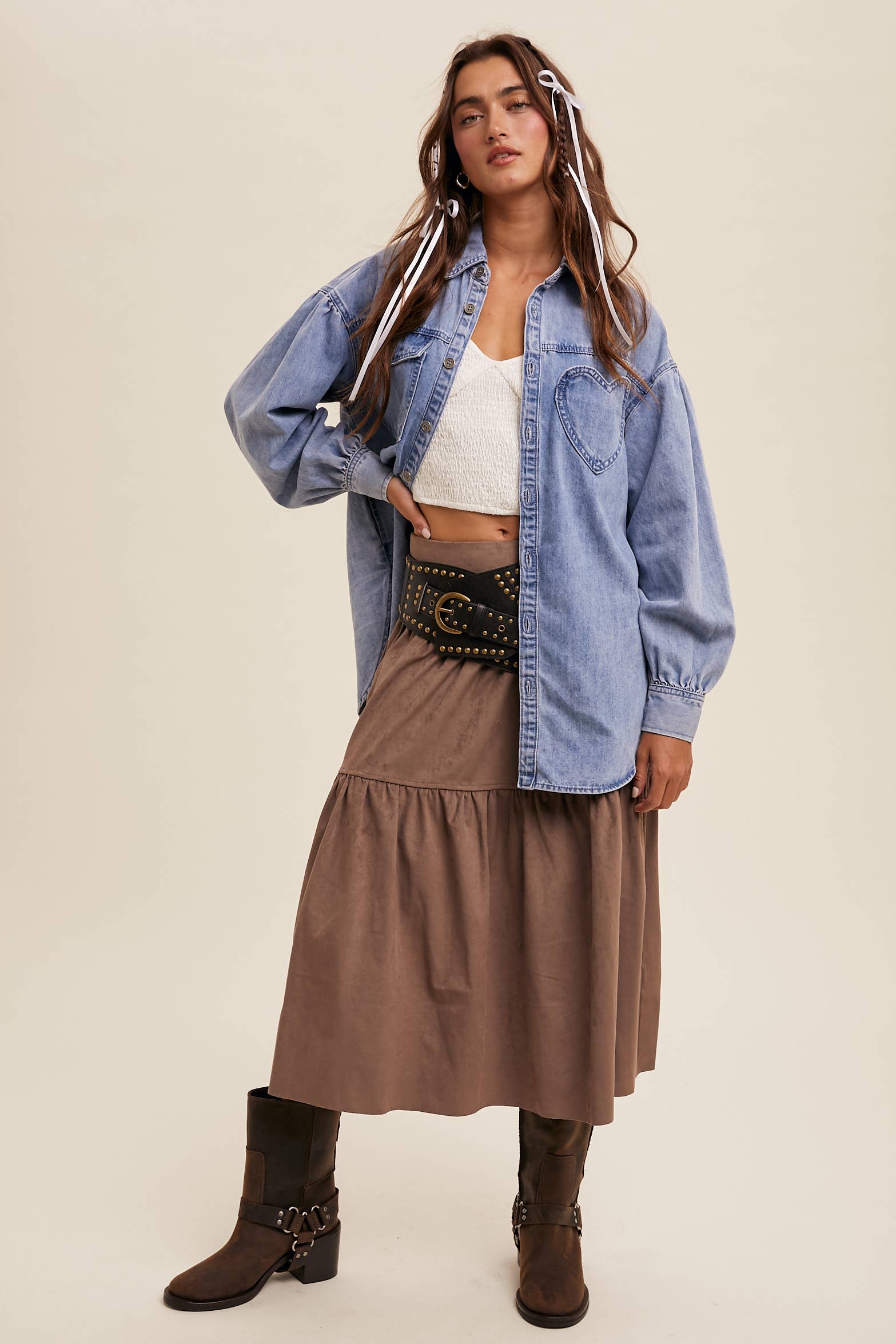 Light-wash oversized denim shacket with a heart-shaped chest pocket, button front, drop shoulders, balloon sleeves, and a curved hem.