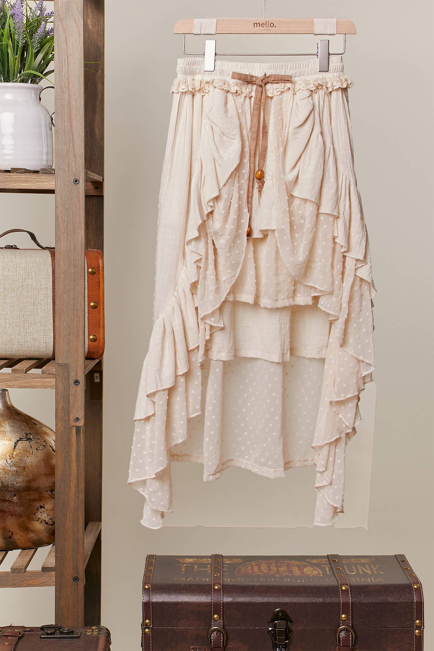 Artisan ivory ruffled maxi skirt - front view showing layered tiered ruffles with wooden bead accents and contrast tie