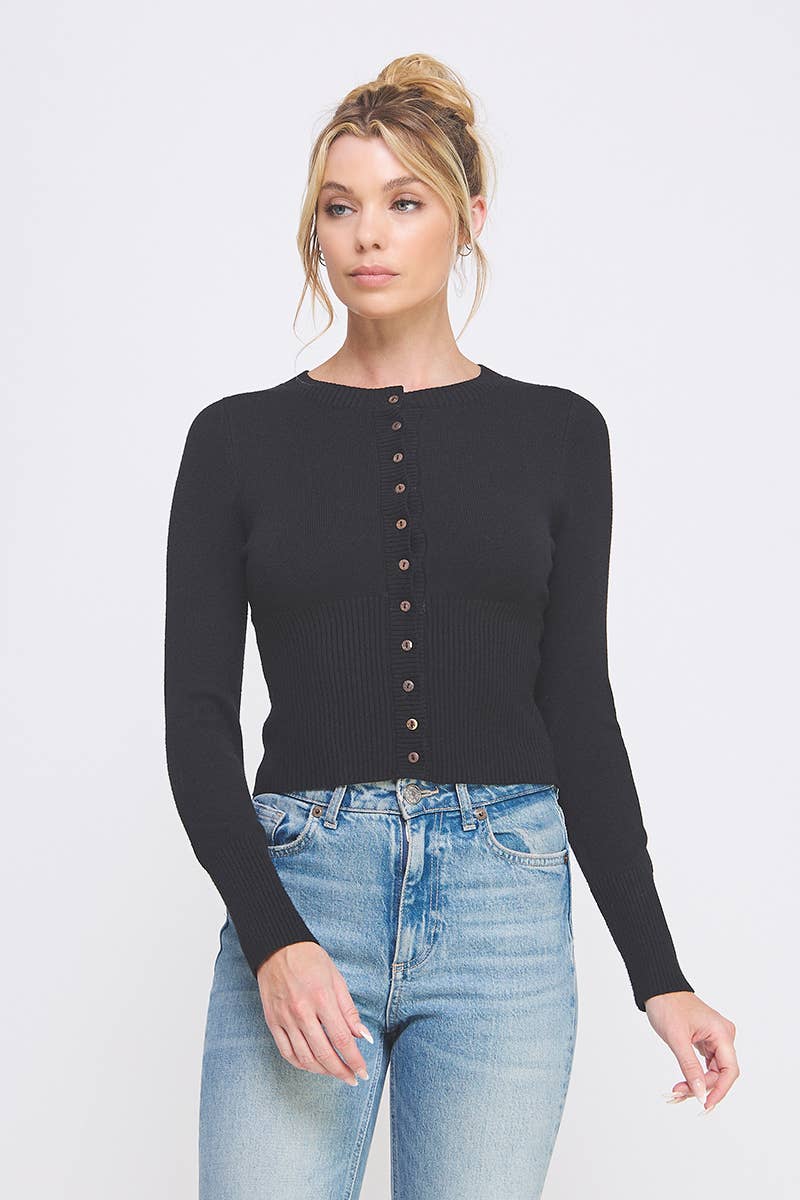 Woman wearing a black long-sleeve viscose cardigan top with buttons