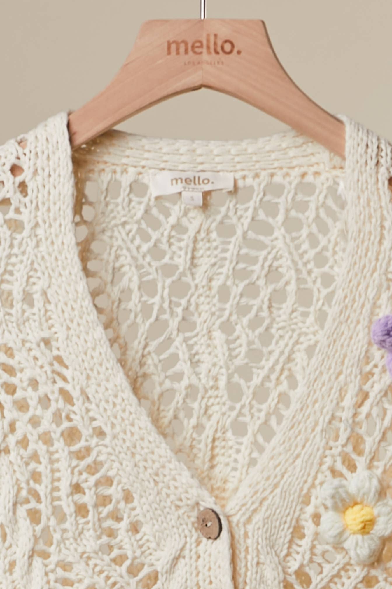 Crochet cardigan side angle - intricate floral detailing with button closure and boho aesthetic