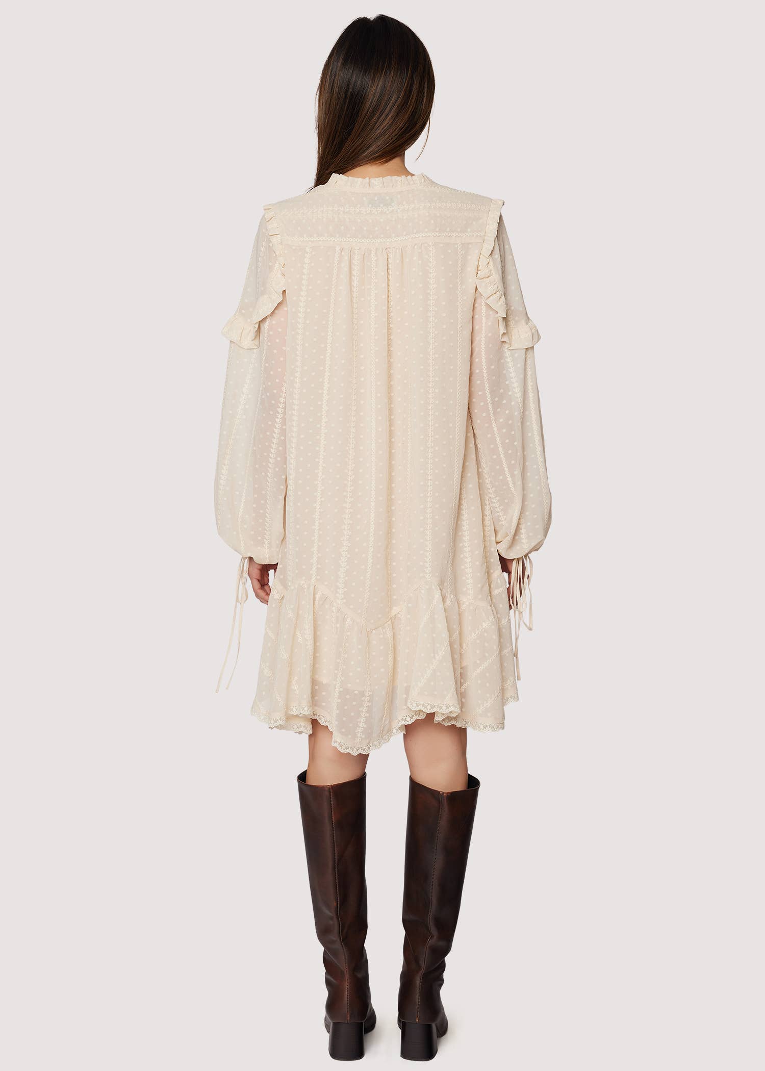 Boho ivory mini dress—V-neck, long blouson sleeves with ties, ruffle details, lace-trimmed hem