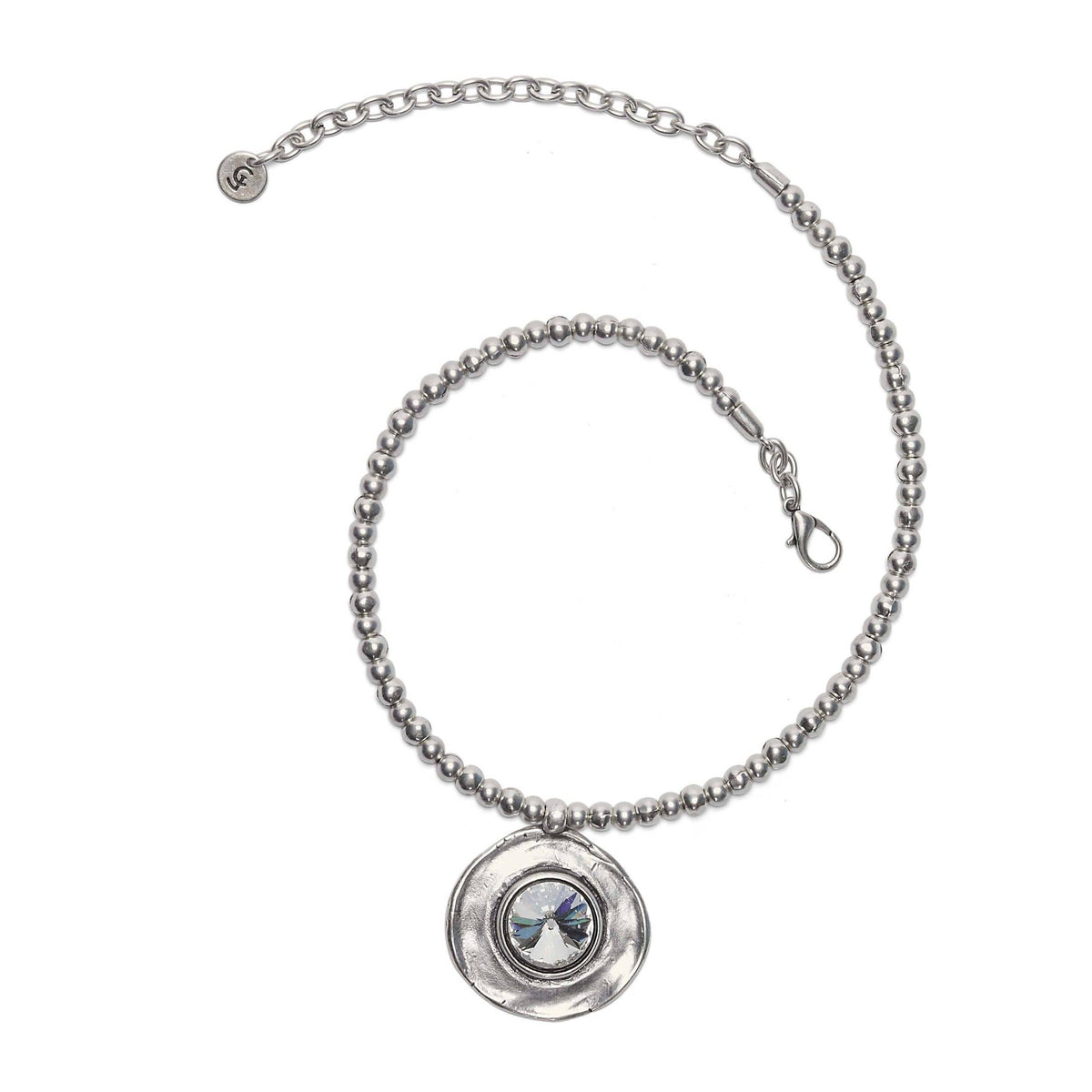 Silver plated crystal and pewter necklace with a round pendant on a white background