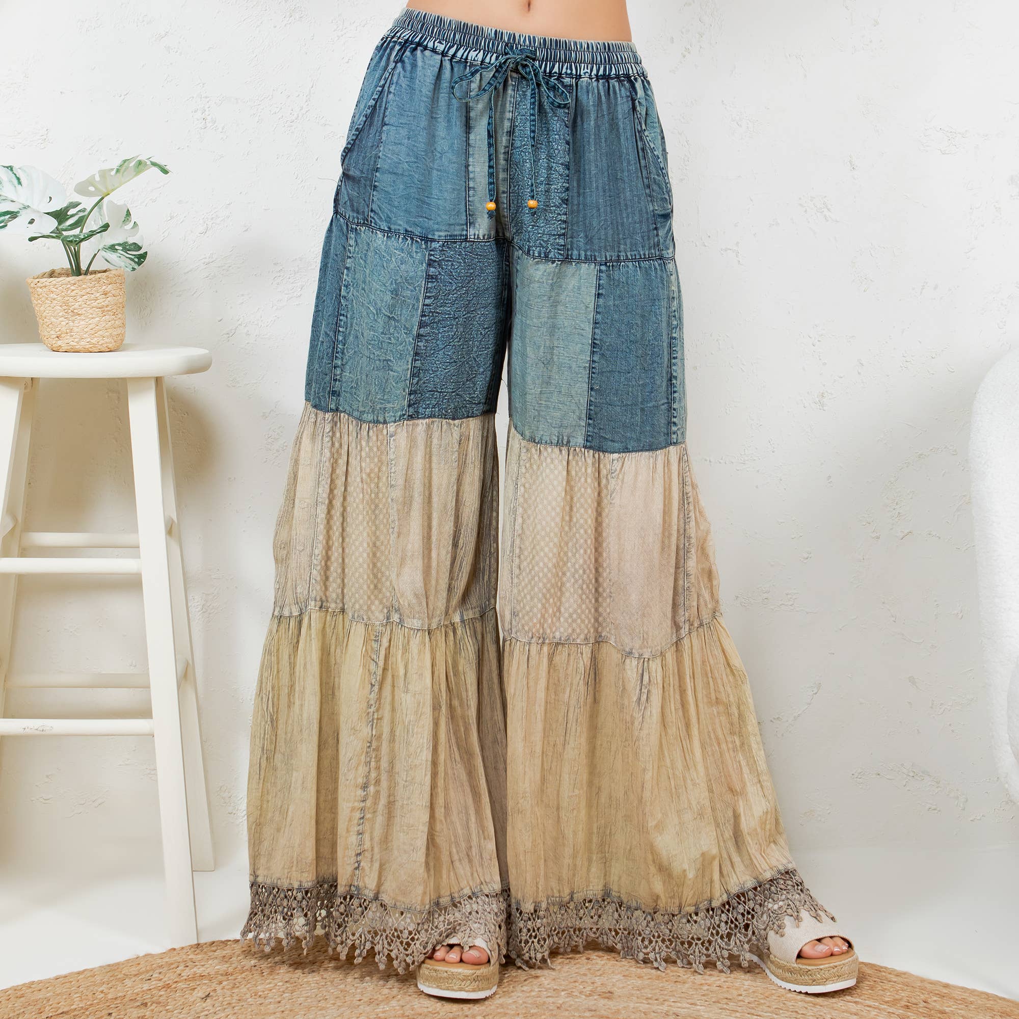 Patchwork pants side angle - full-length design showing sweater knit, rayon and lace fabric transitions
