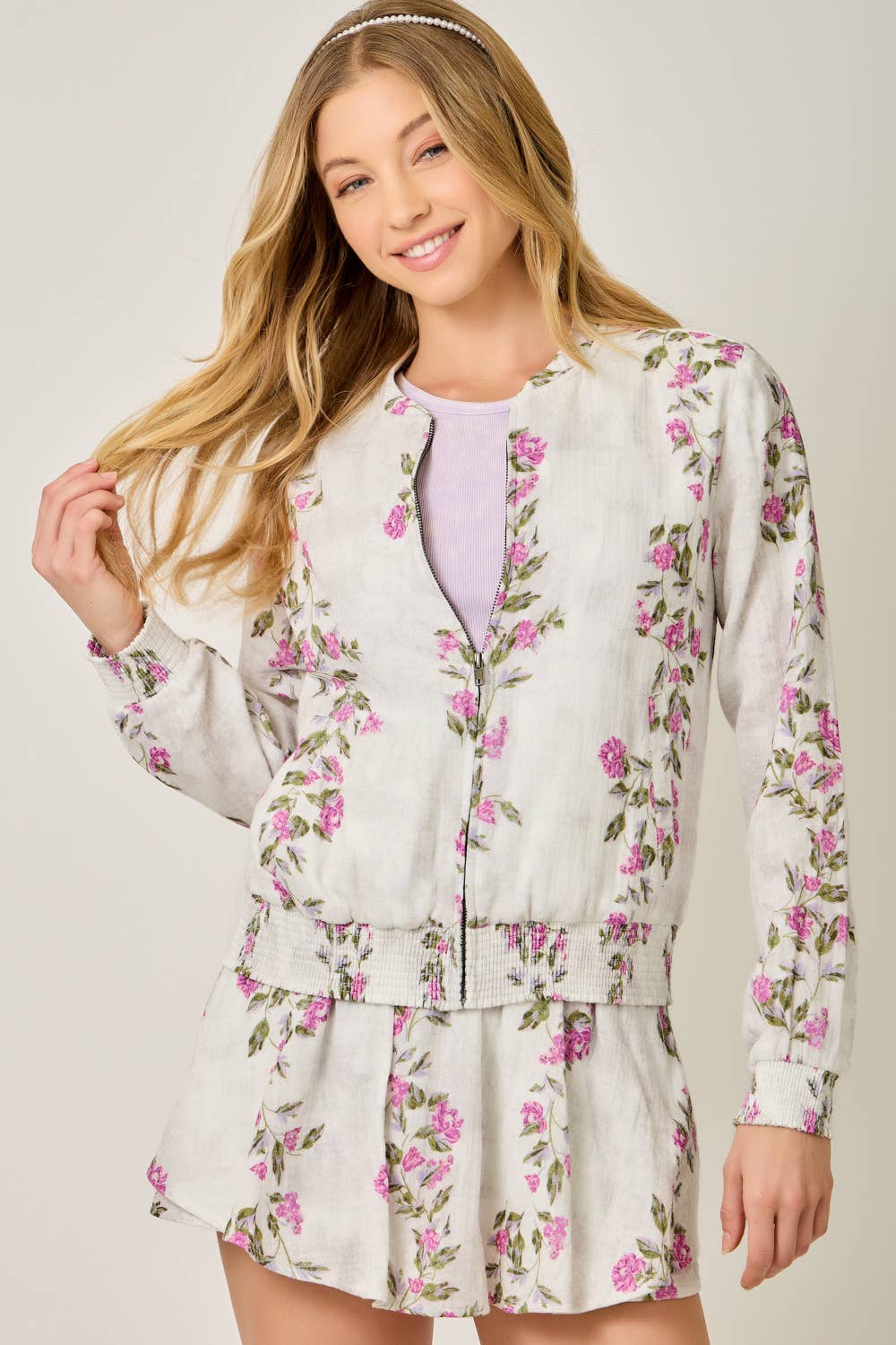 The Rosewood Floral Bomber - front view showing floral print and front zipper closure