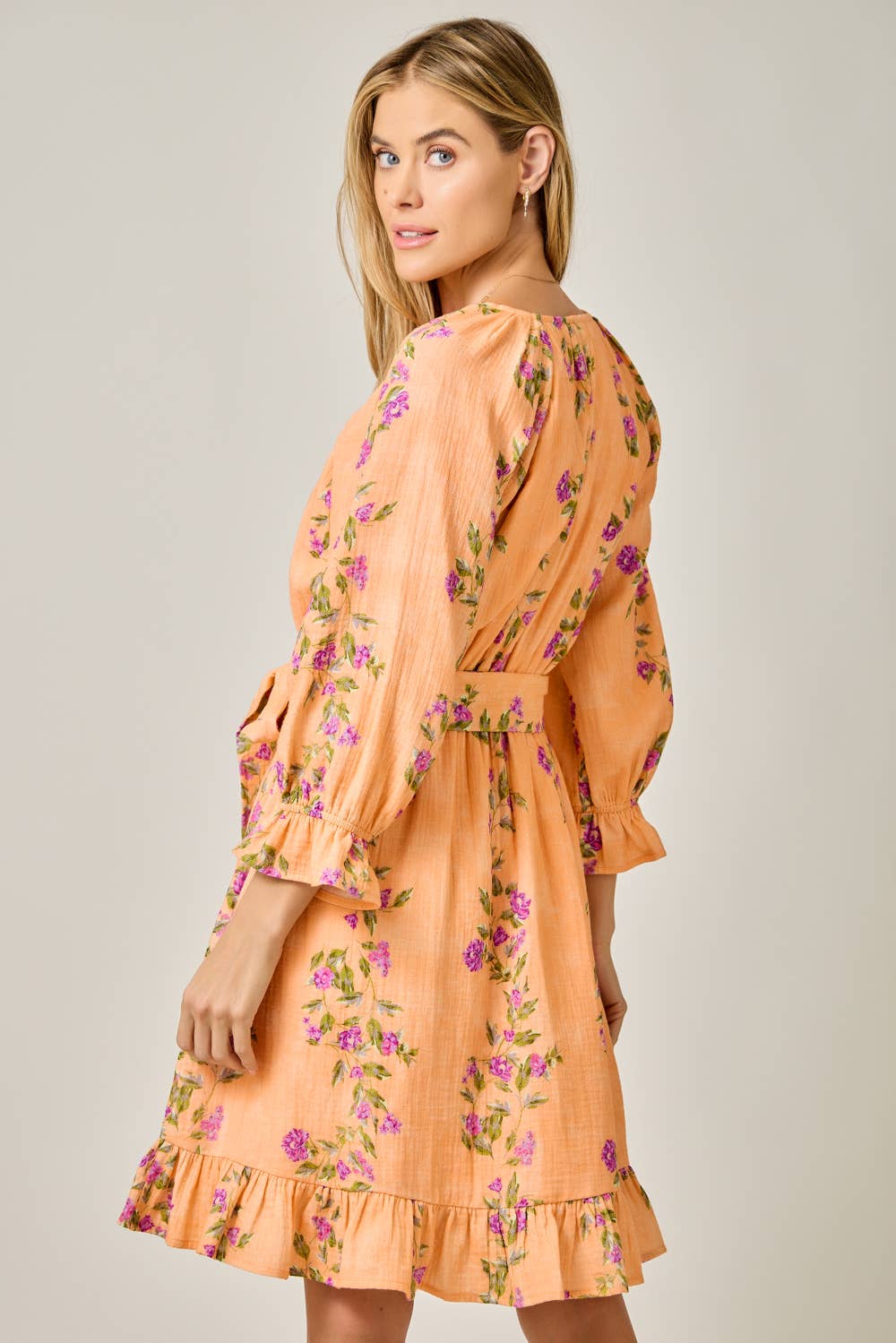The Valencia Floral Wrap Dress in Sherbet Orange - back view highlighting wrap design