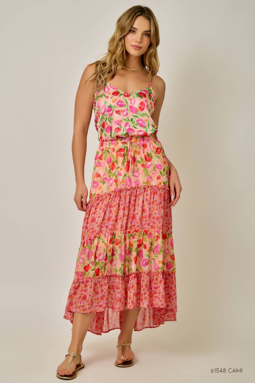 Woman wearing a floral dress on a plain background