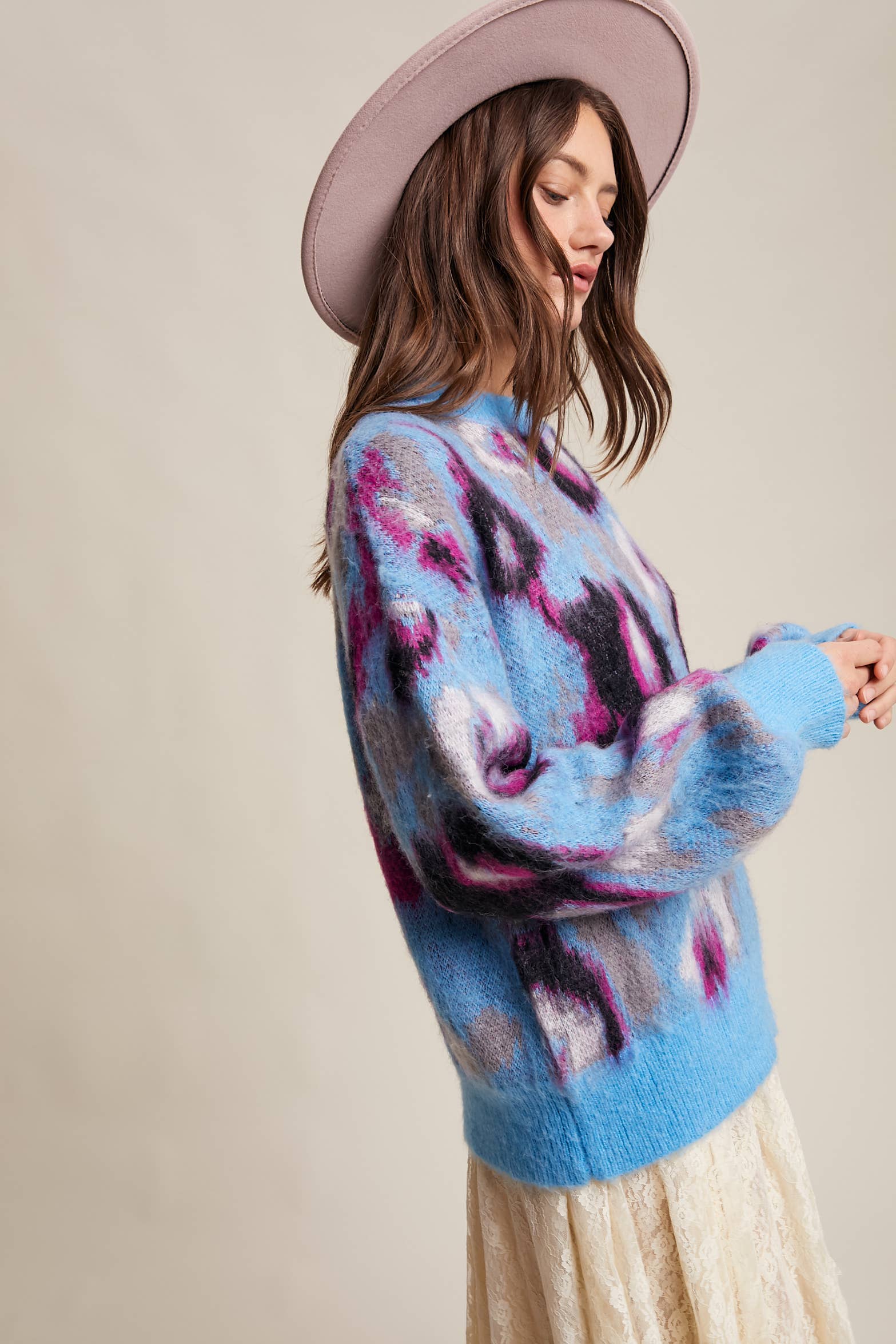 Women’s fuzzy abstract leopard knit pullover sweater with soft textured fabric and bold animal print — cozy statement top for modern chic outfits.