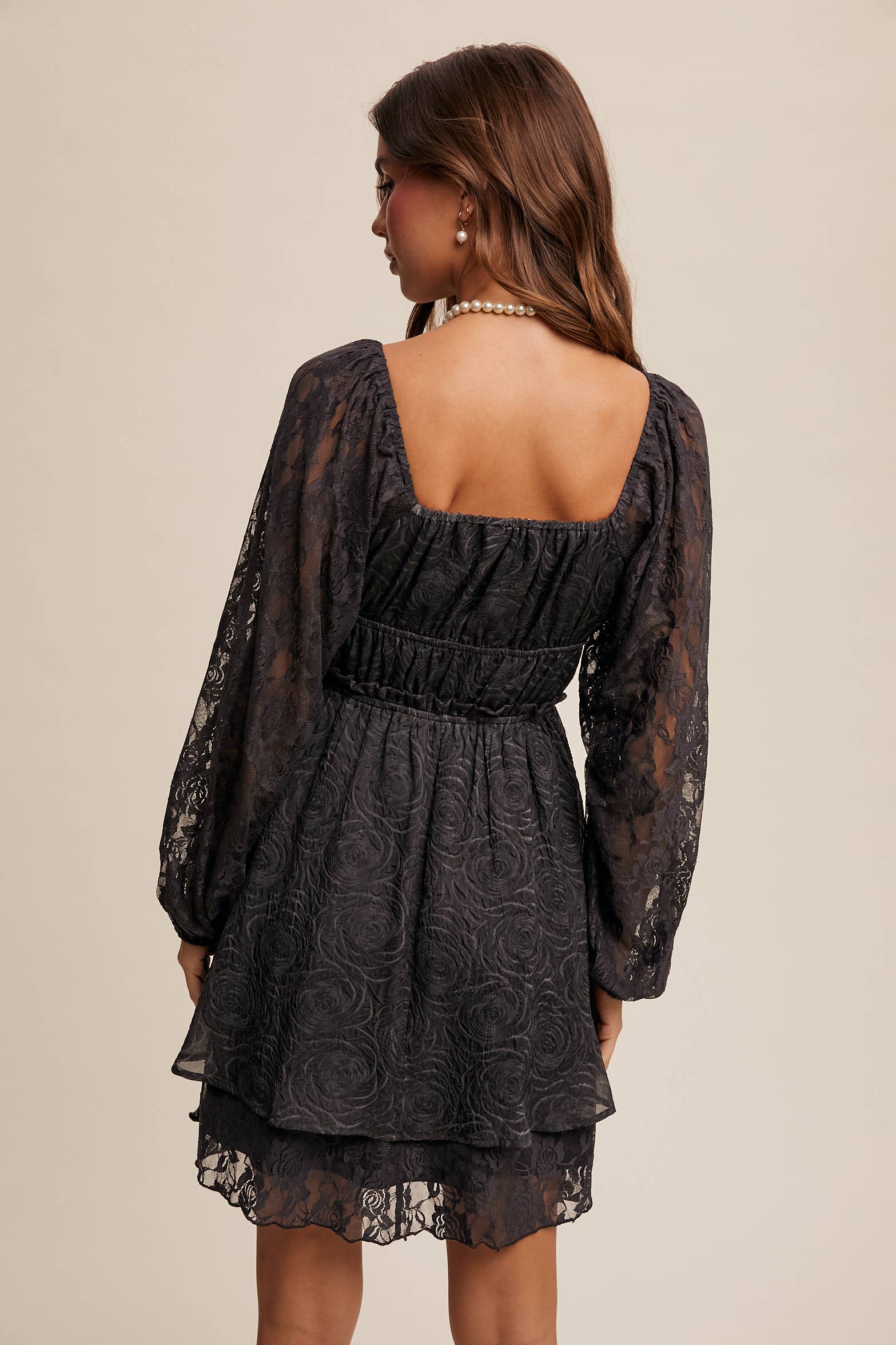 Back view of floral lace detailing and layered hem on The Midnight Lace Dress