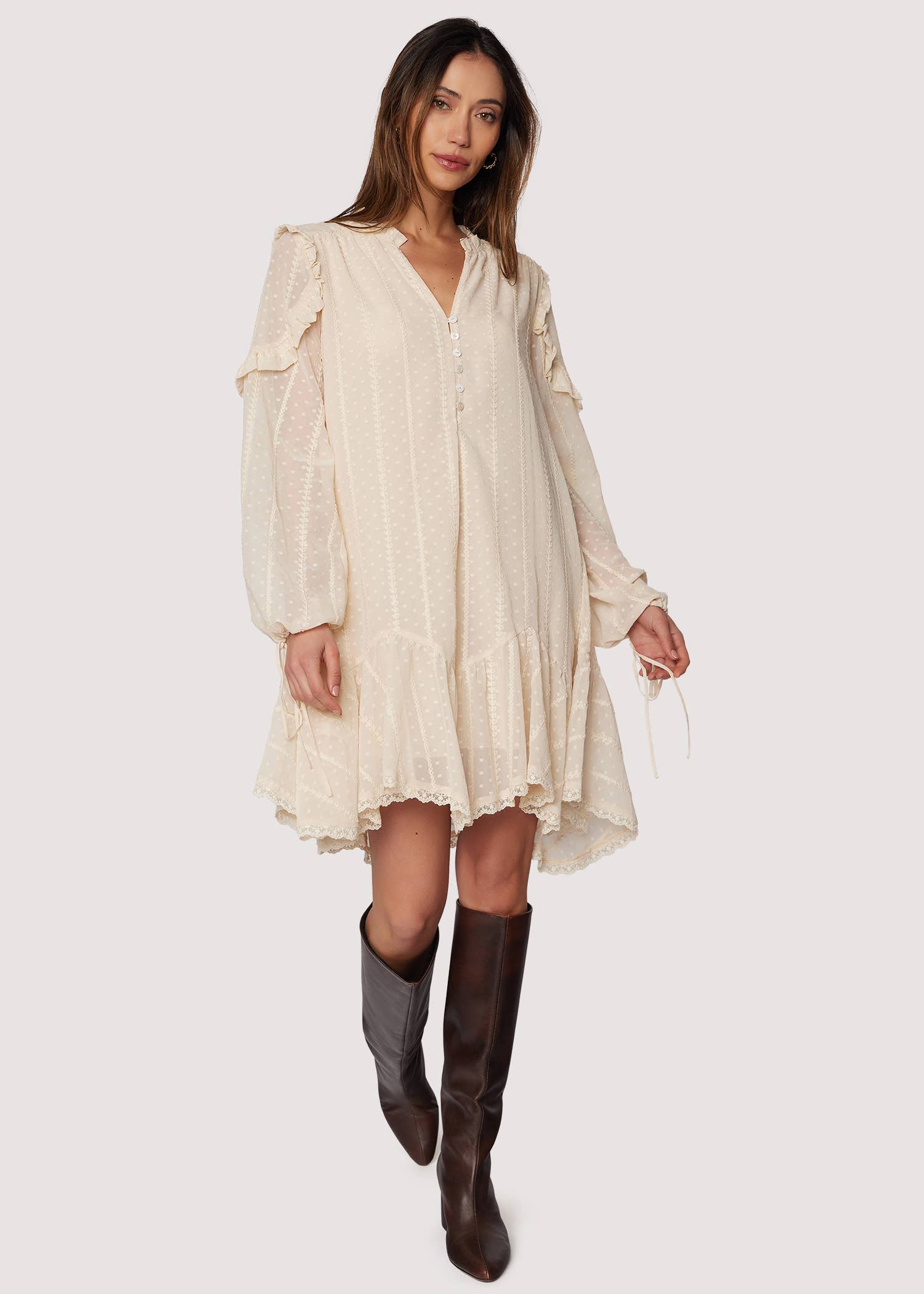 Boho ivory mini dress—V-neck, long blouson sleeves with ties, ruffle details, lace-trimmed hem