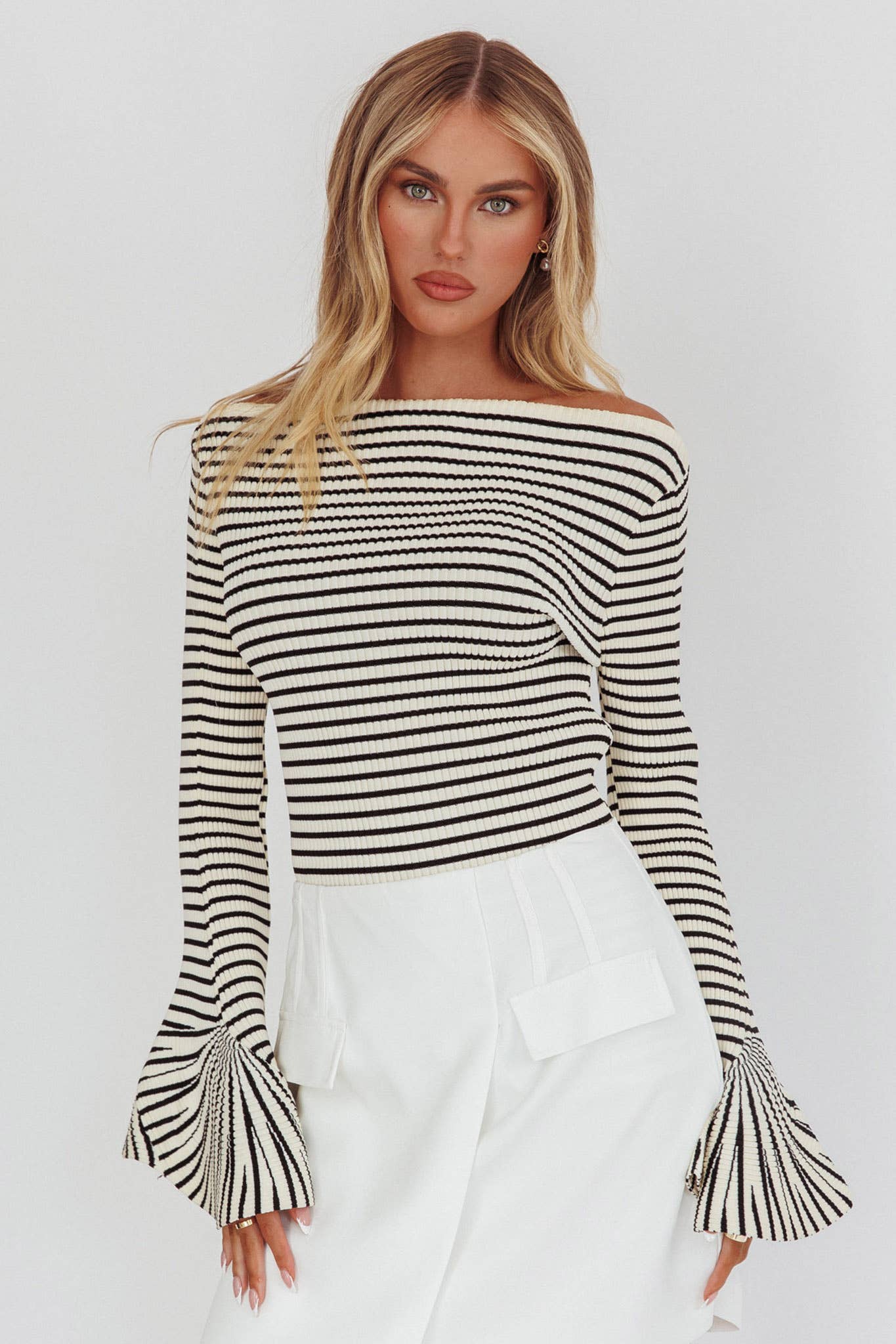 Black-and-ivory horizontal stripe sweater, ribbed, long sleeves with flare