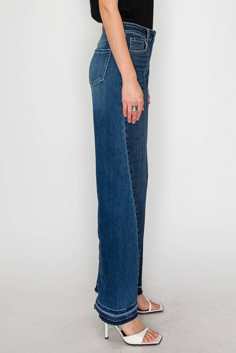 Wide flare jeans side angle - leg-lengthening silhouette with structured flare and premium stretch denim