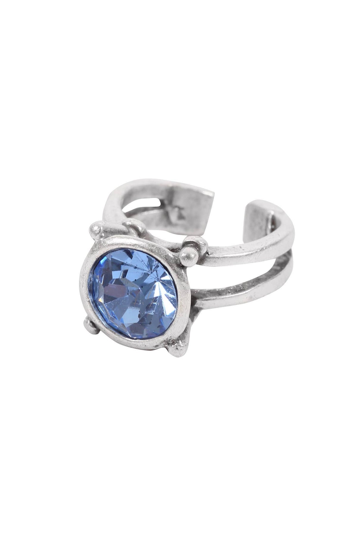 A silver-toned adjustable ring featuring a round, faceted light blue gemstone in a prong setting, shown against a plain white background.