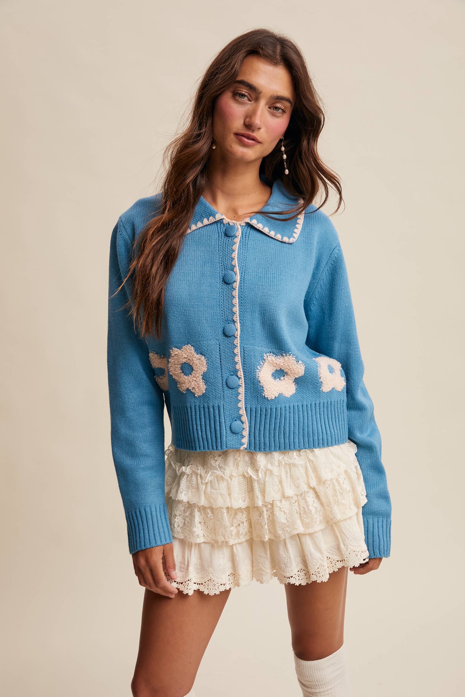 Women’s floral collar knit cardigan with button-front design, soft textured fabric, and contrast flower-patterned collar — stylish layering sweater for everyday wear.