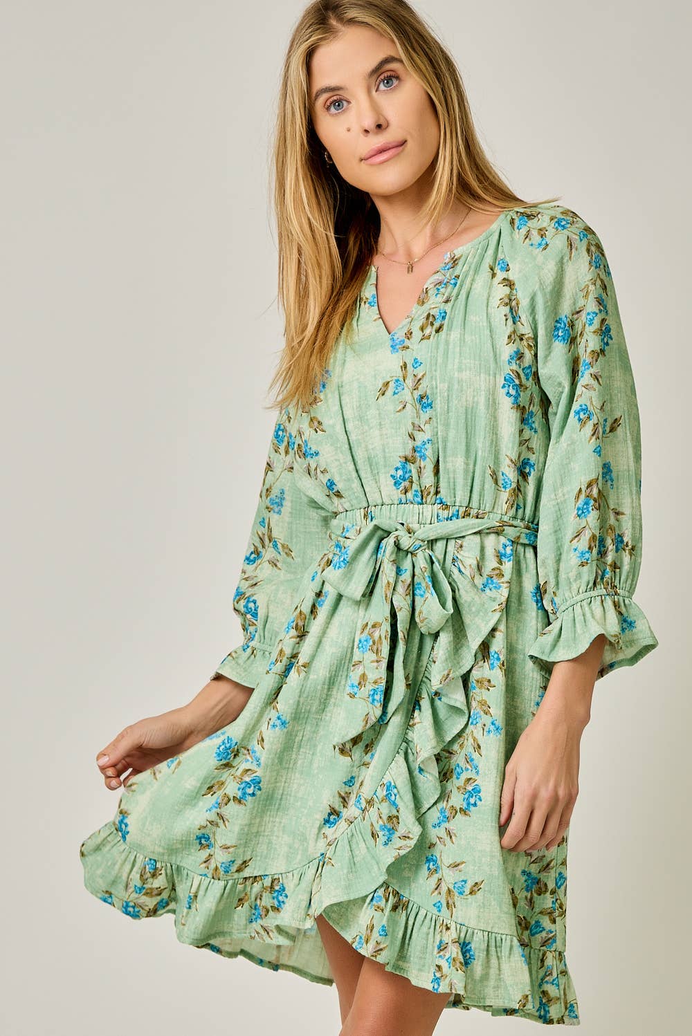 The Valencia Floral Wrap Dress - front view showing V-neck and floral print in Sherbet Green