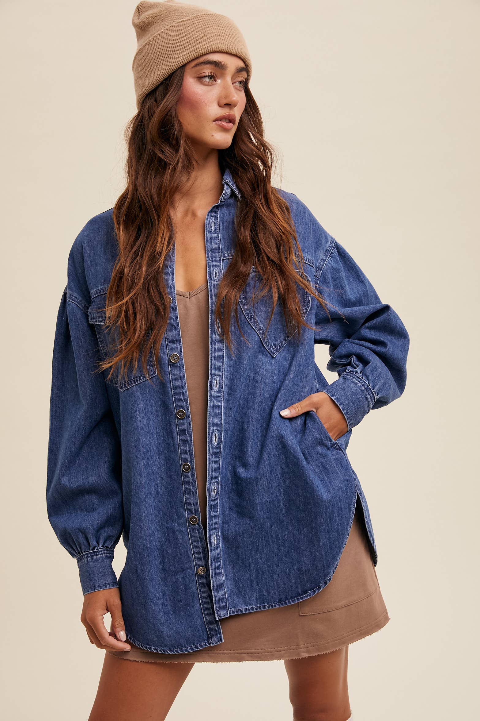 Light-wash oversized denim shacket with a heart-shaped chest pocket, button front, drop shoulders, balloon sleeves, and a curved hem.
