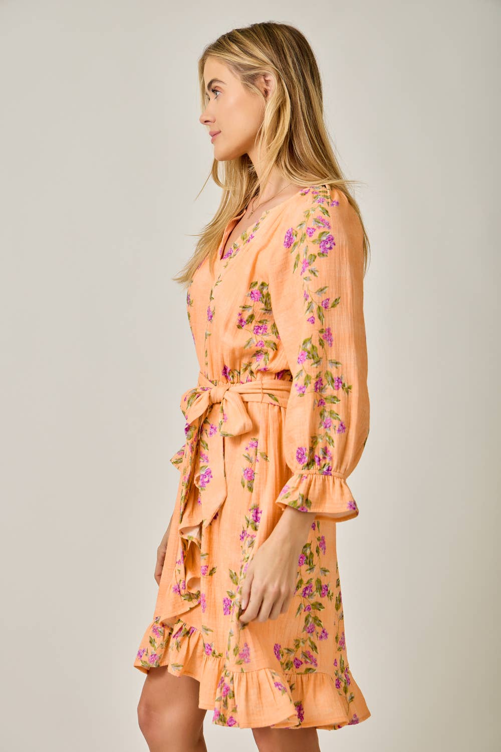 The Valencia Floral Wrap Dress in Sherbet Orange - side view showing 3/4 bubble sleeves