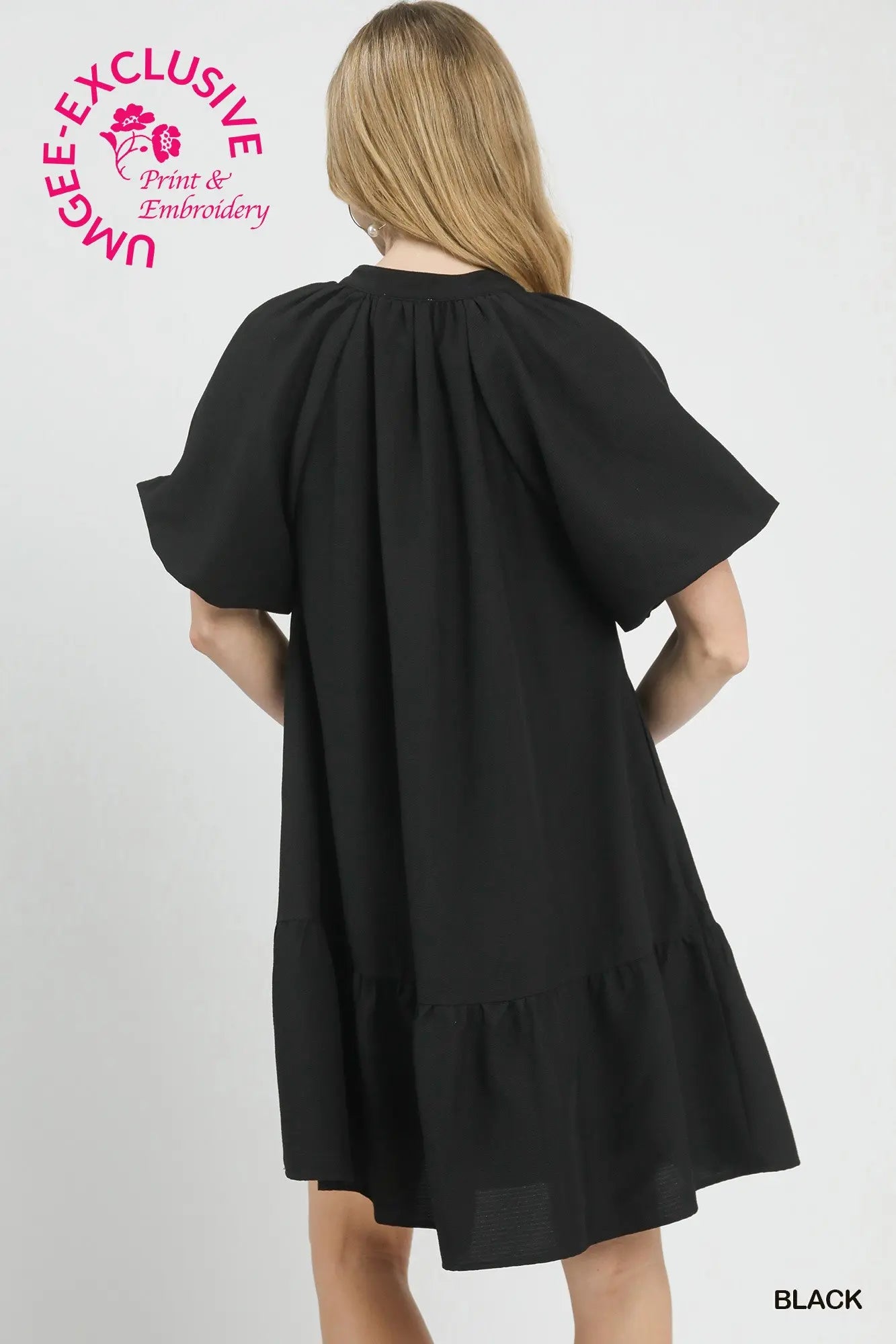 gathered yoke, voluminous flutter sleeves, tiered skirt, clean solid black reverse