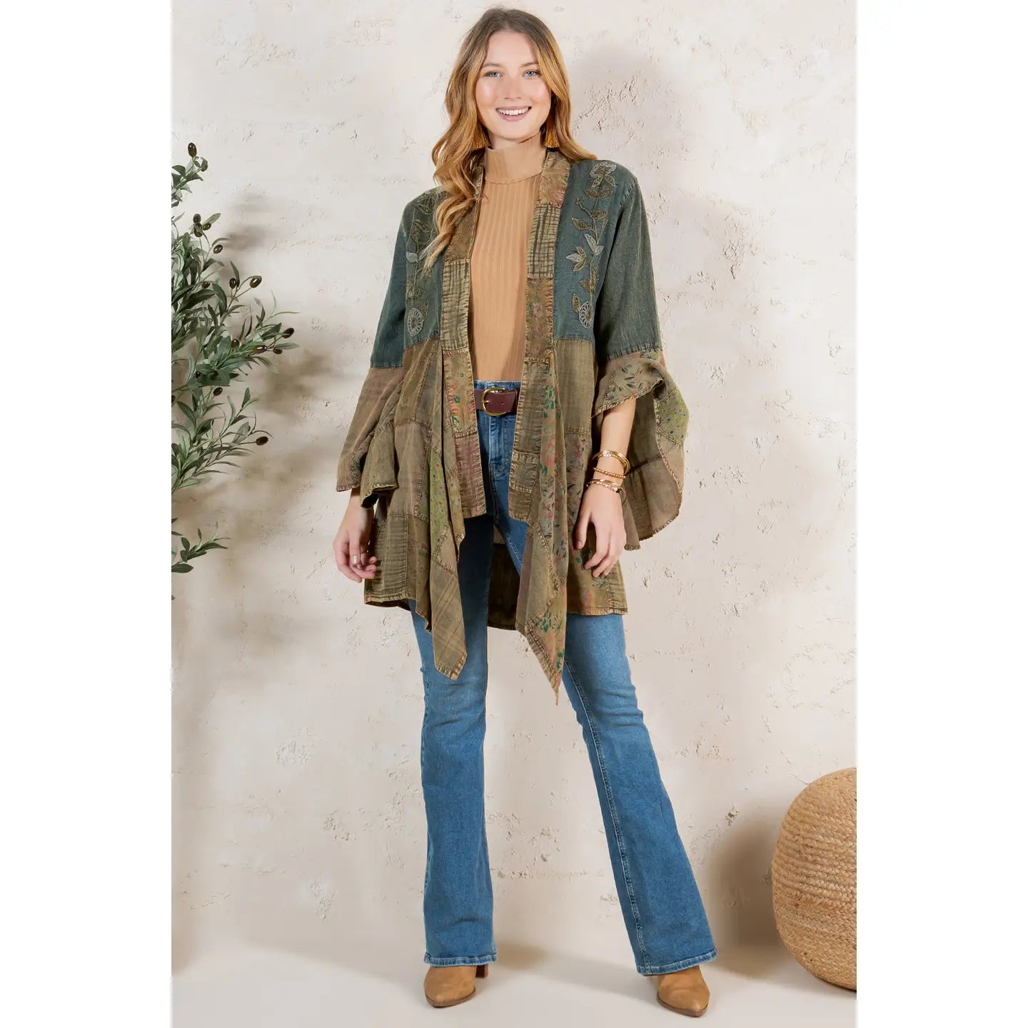 Studio front view, turtleneck + flare jeans styling