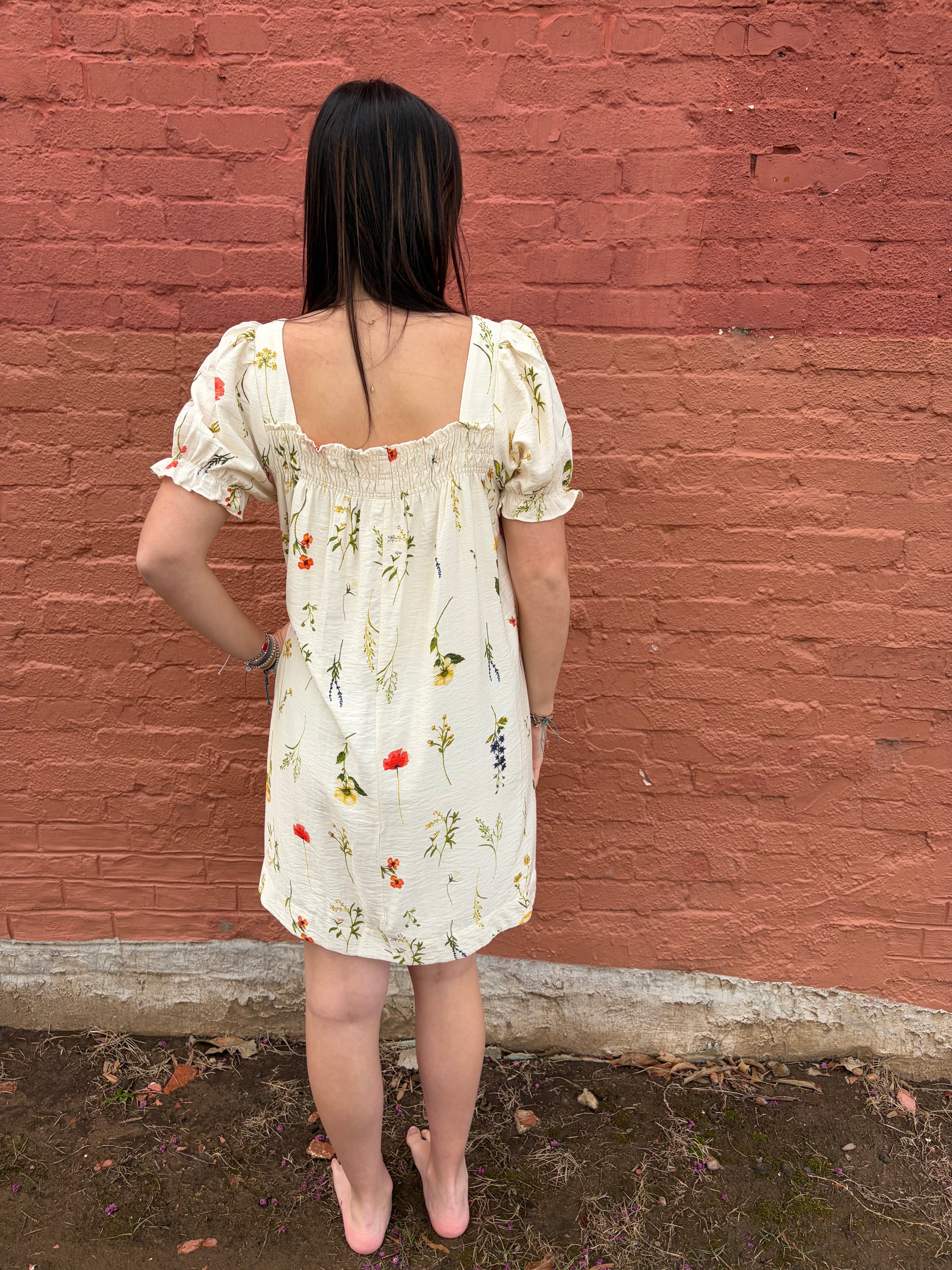 Back view of the Breezy Days floral white mini dress