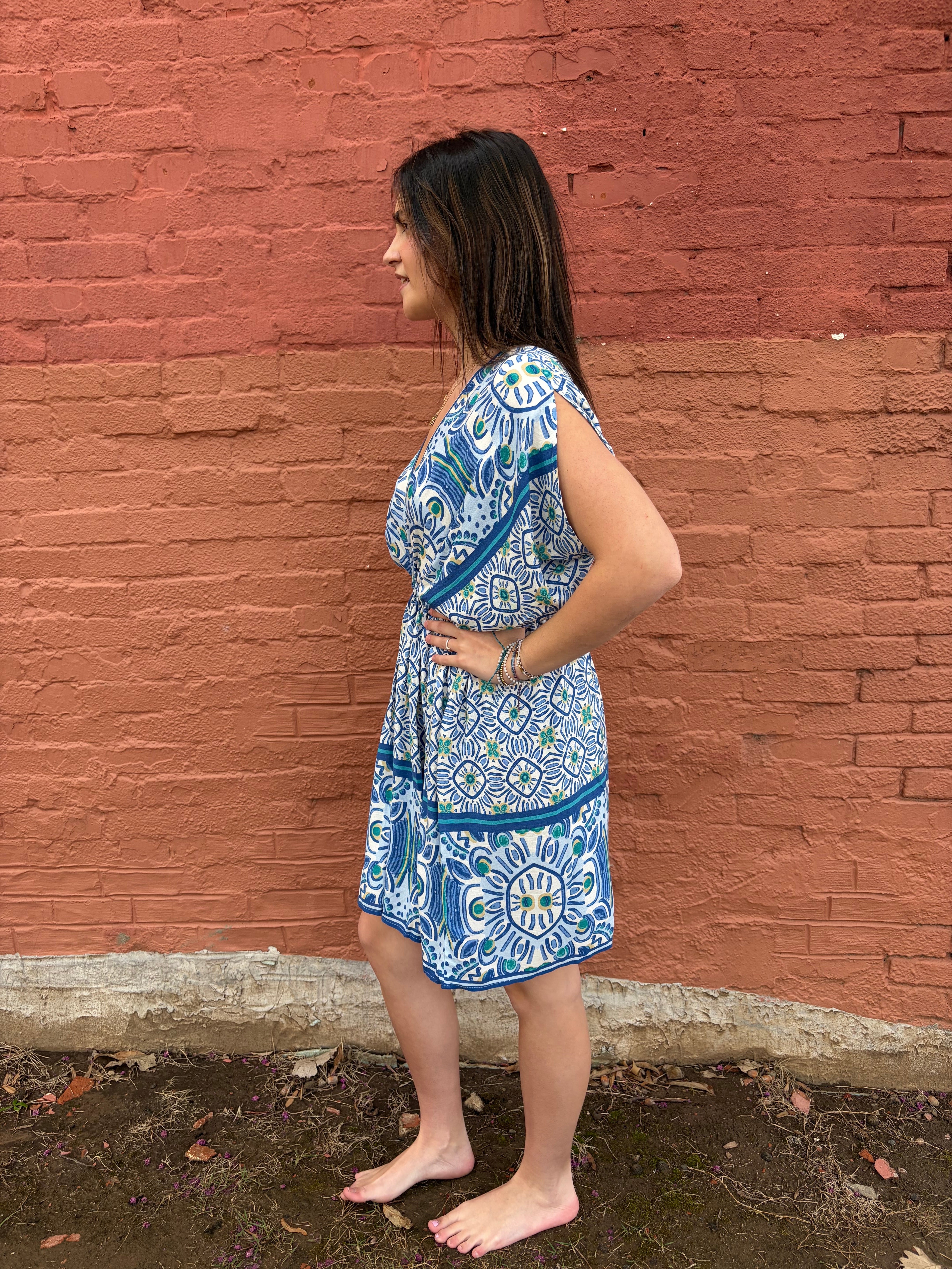 Side view of model wearing the blue Haydee Mini Dress