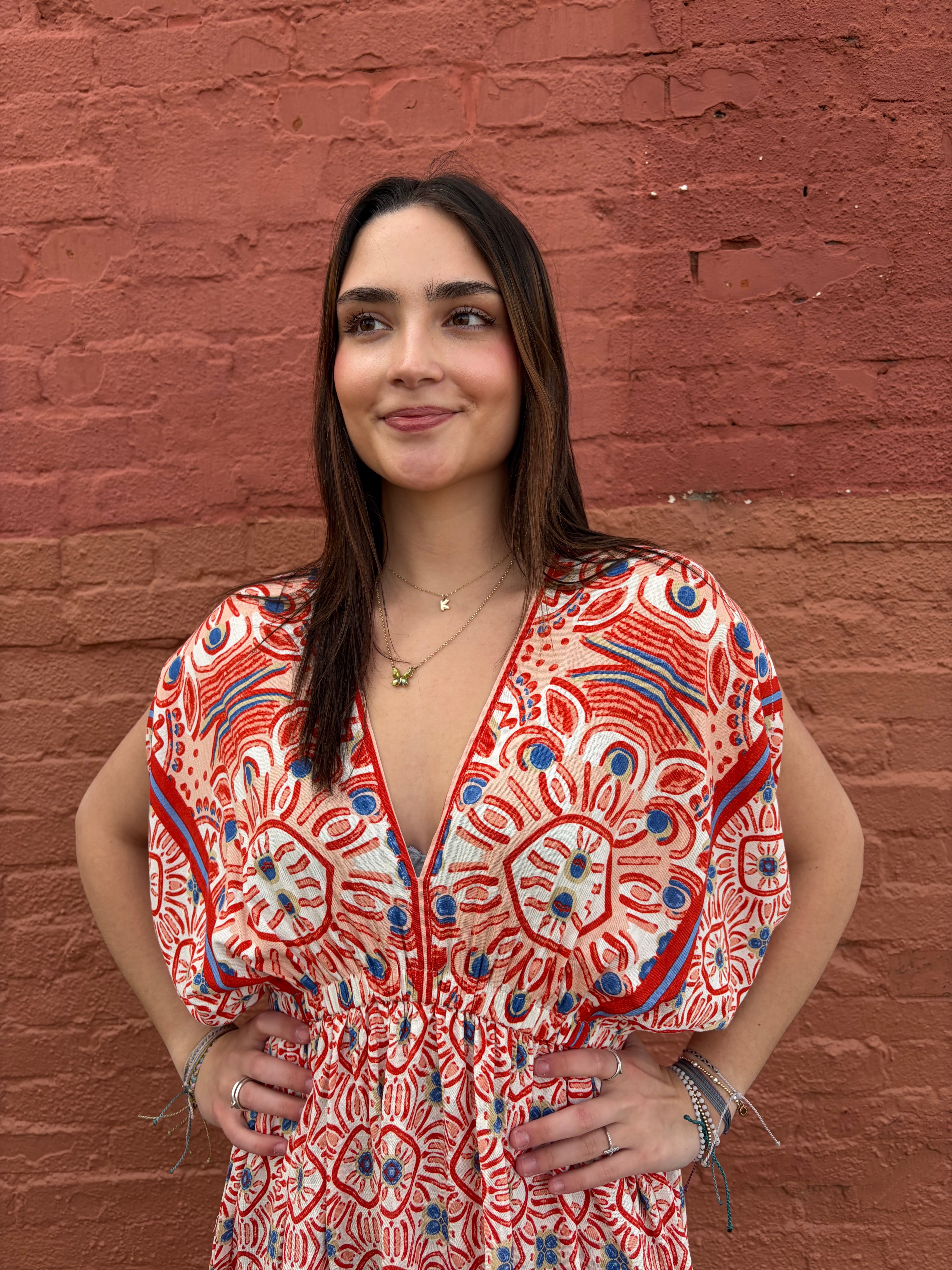 Close up of model wearing the red Haydee Mini Dress