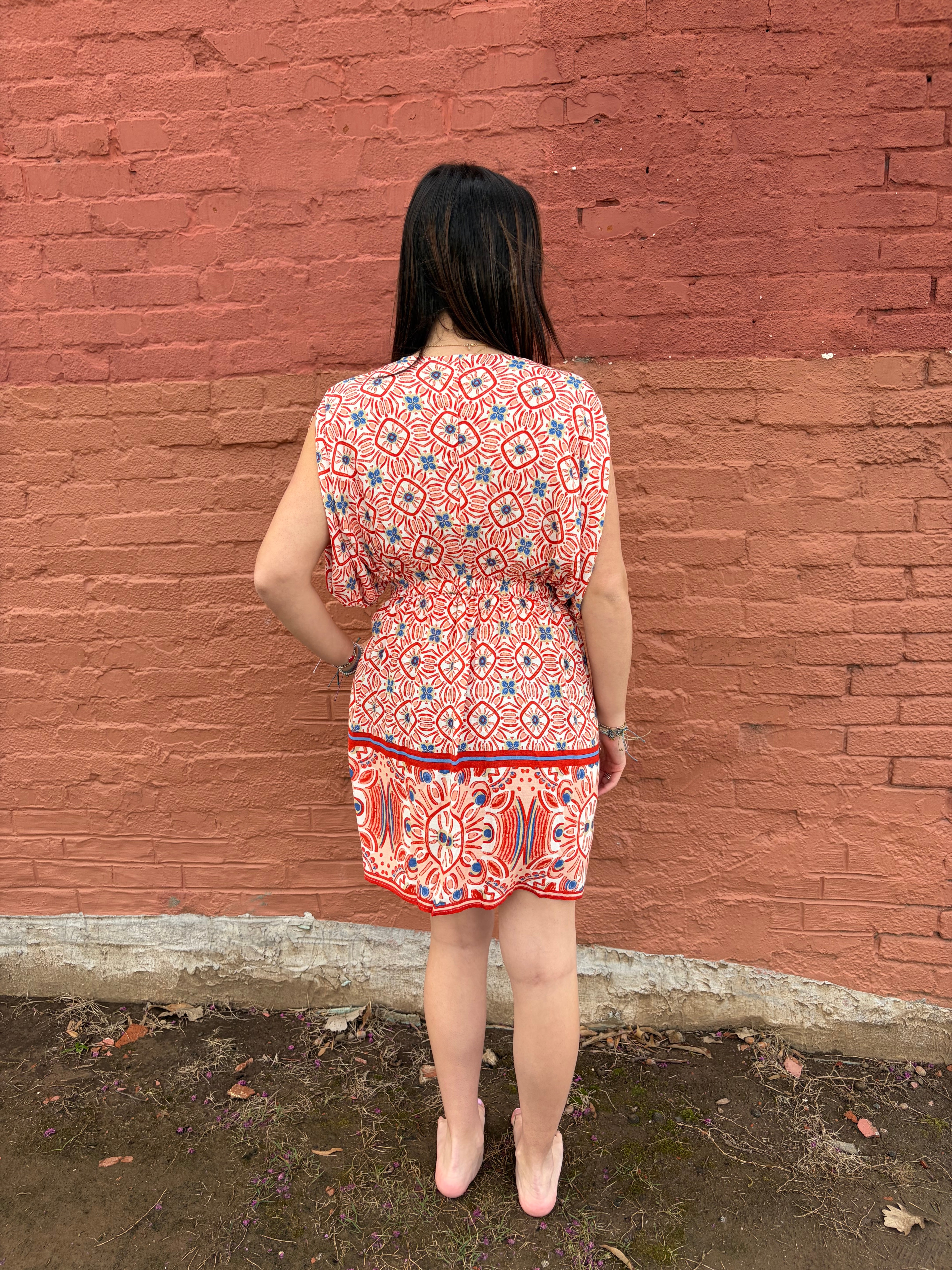 Back view of model wearing the red pattern Haydee Mini Dress