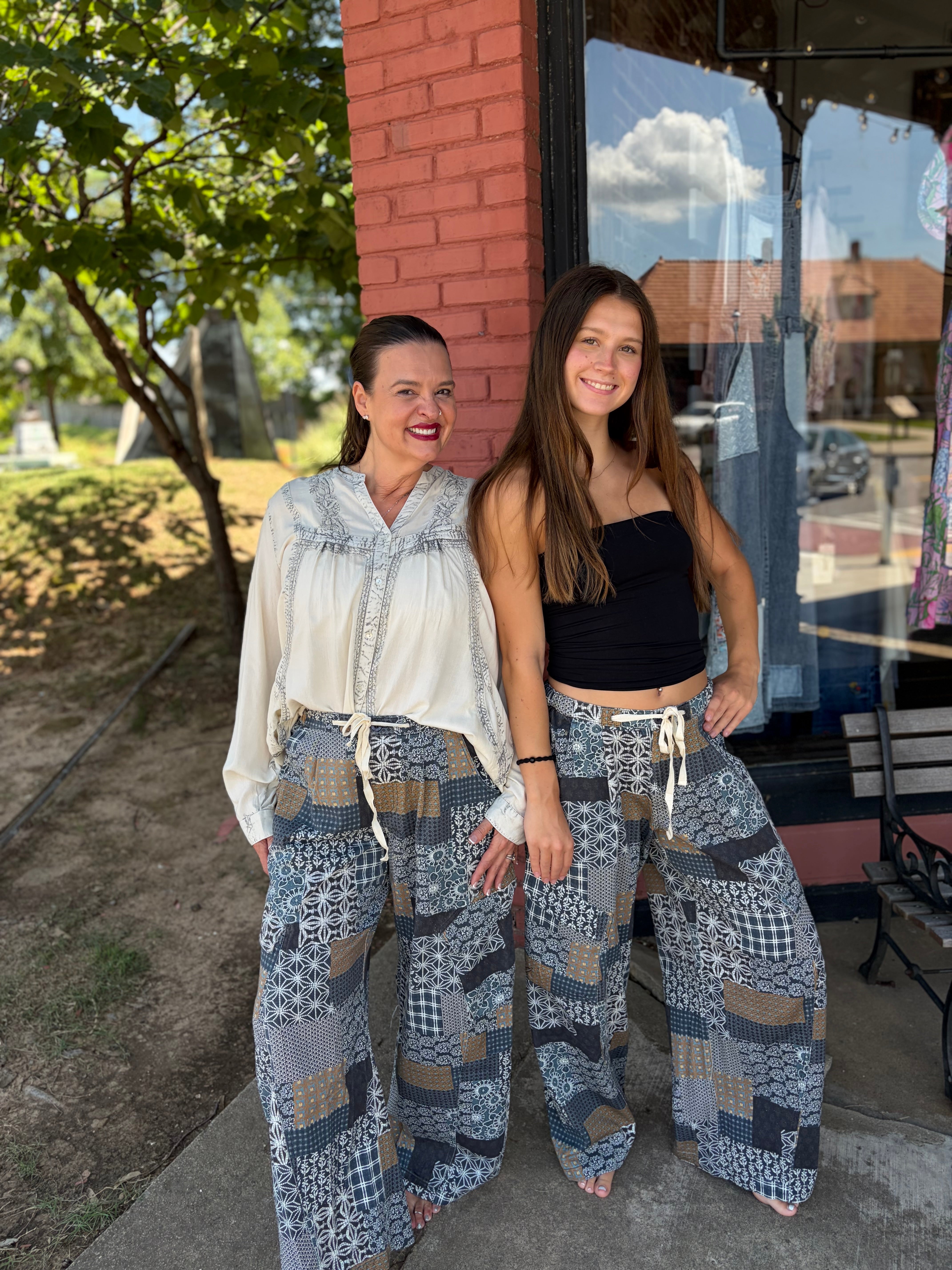 Patchwork print barrel leg pants styled outfit – bohemian fashion showing two models