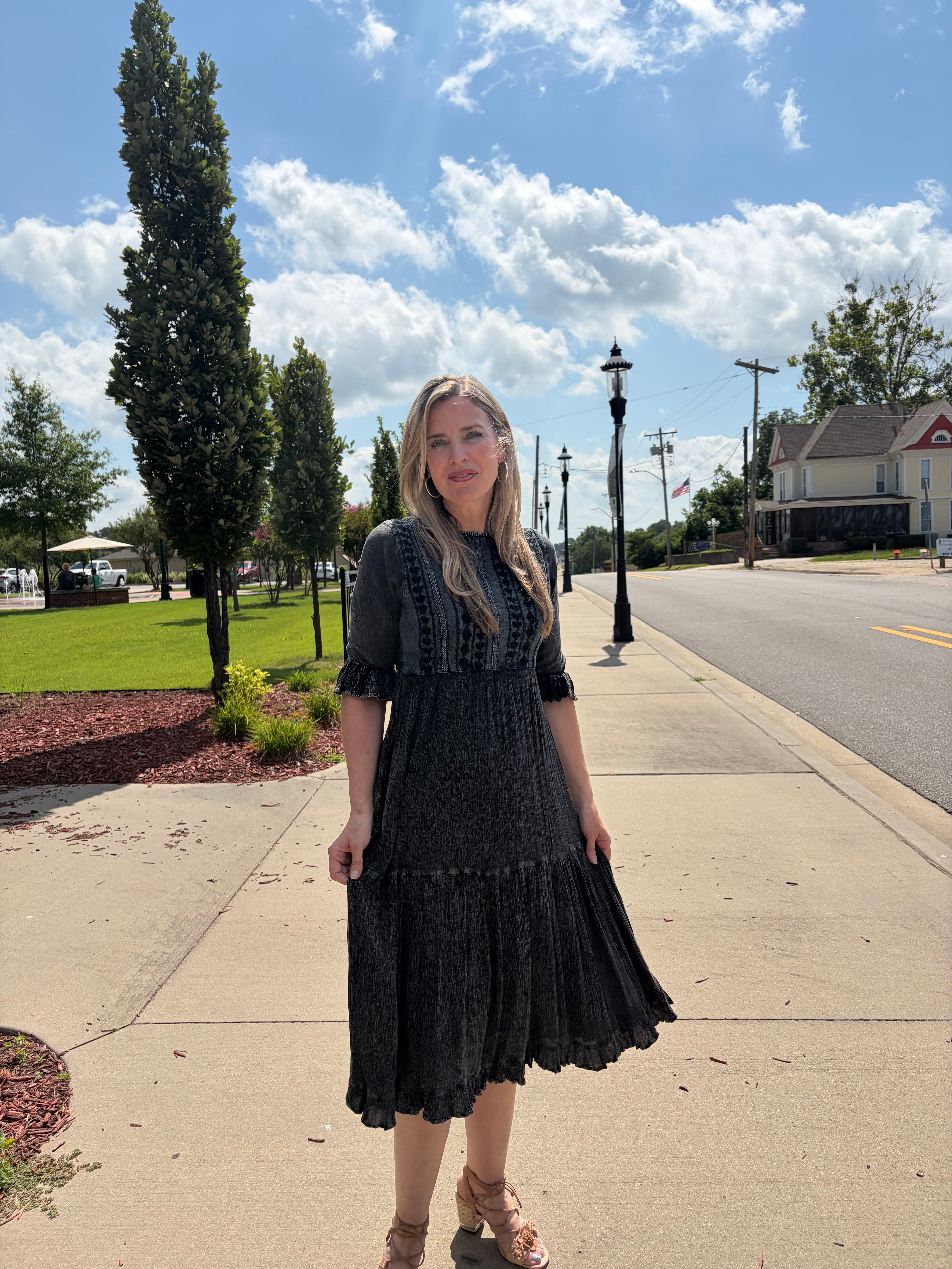Charcoal denim fusion tiered midi dress showing tiered skirt movement and fringe hem