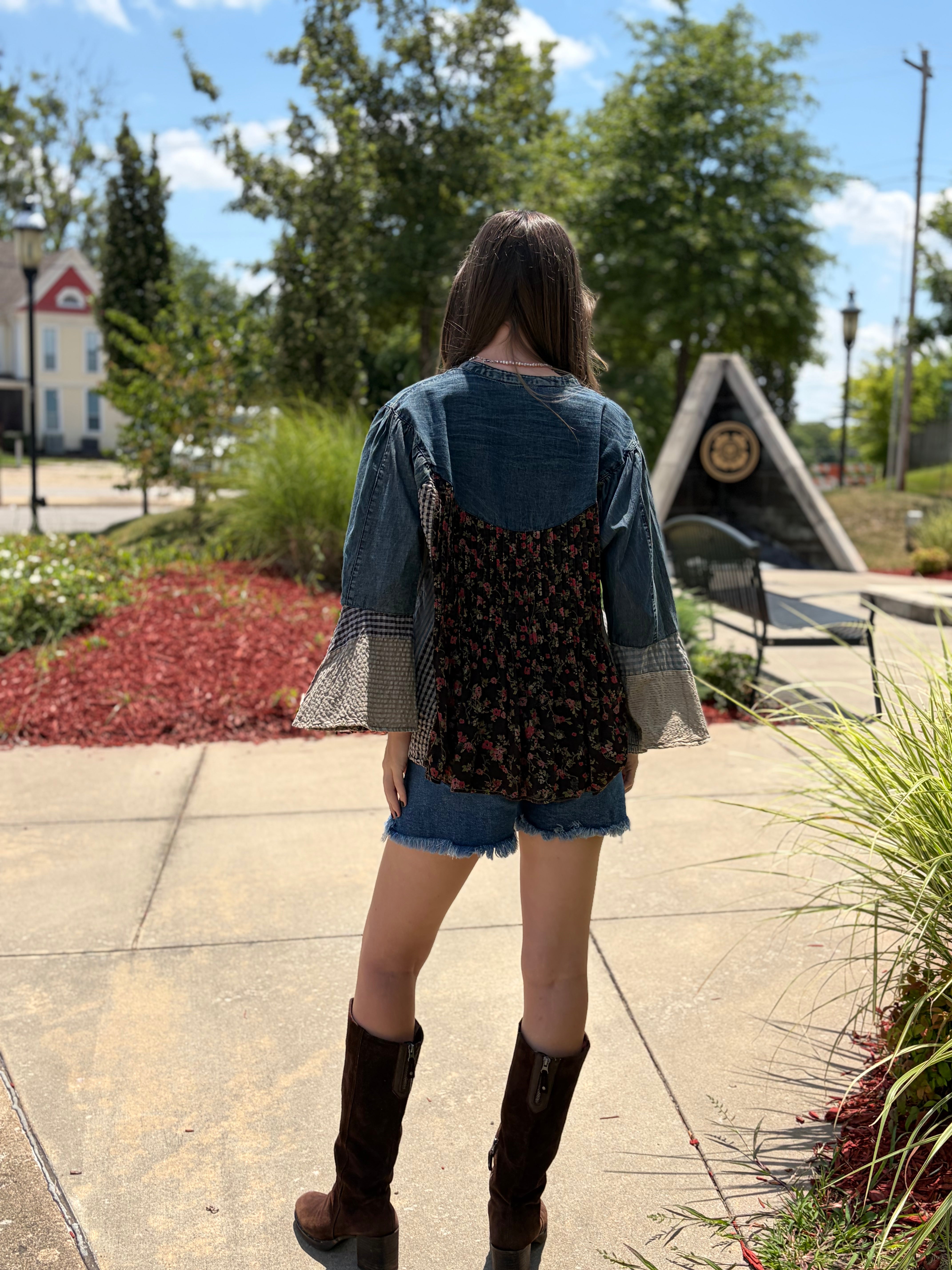 Full back view, denim yoke + dark floral center + plaid bell sleeves